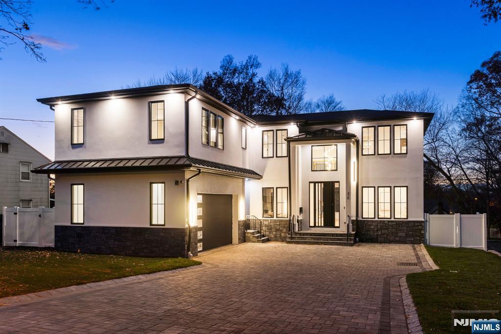 Welcome to this Stunning, Brand-New Construction home built by well-known local builder situated on a premier street that truly captures the essence of modern luxury. This spectacular residence showcases exceptional contemporary elegance. Enter thru a dramatic 20-ft foyer w custom pivot door that leads to formal living & dining areas, opening to a sprawling family room with 10-ft ceilings, fireplace feature, & wall of windows highlighting all the natural sunlight. The kitchen features Sub-Zero/Wolf appliances, Venetian-plaster hood, custom cabinetry, and quartz counters with waterfall island, plus a walk-in pantry and butlerâ€™s station. 1st flr guest suite, and a custom mudroom with access to an oversized 2-car garage complete the main level. Upstairs offers 3 ensuite bedrooms, a beautiful laundry room, and a luxurious primary wing with vaulted bedroom & fireplace, private library/office or sitting room , spa bath with oversized shower & soaking tub, and two exceptional closets including a full couture dressing room. The walk-out lower level includes a large rec room w full wet bar, glass-enclosed gym, home theatre, game room, wellness/sauna room, bedroom with full bath, and access to the fenced yard with room for a pool. Paver driveway/patio, premium lighting & cove accents, sound system, and generator hookup complete this extraordinary home. Donâ€™t miss the opportunity to live in the desirable Paramus with easy accessibility, fantastic schools & lower taxes!