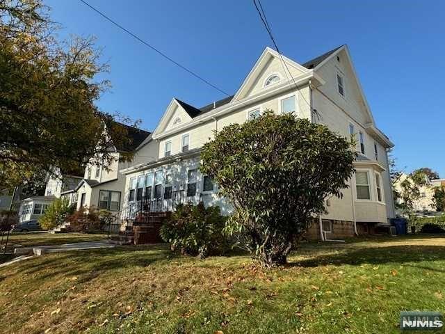 This charming and sun-filled 3-bedroom, 1.5-bath duplex house offers a fantastic location and an inviting layout perfect for comfortable living. Step into the bright, enclosed porch, flooded with natural light, before entering the spacious formal living and dining rooms. The first floor features a large eat-in kitchen equipped with stainless steel appliances and a convenient half bath. Upstairs, you'll find a master bedroom, two additional generously sized bedrooms, and a full bath. The basement includes a washer and dryer with ample storage space. Ideal for commuters, this home is just a few blocks from the NYC train station and nearby NYC bus stops, with easy access to Rutherford's vibrant downtown area, including shops, restaurants, schools, a movie theater, and major highways. The property also includes an extra-large shared backyard, perfect for outdoor relaxation. Freshly painted, with central AC, and move-in ready. No pets allowed.
