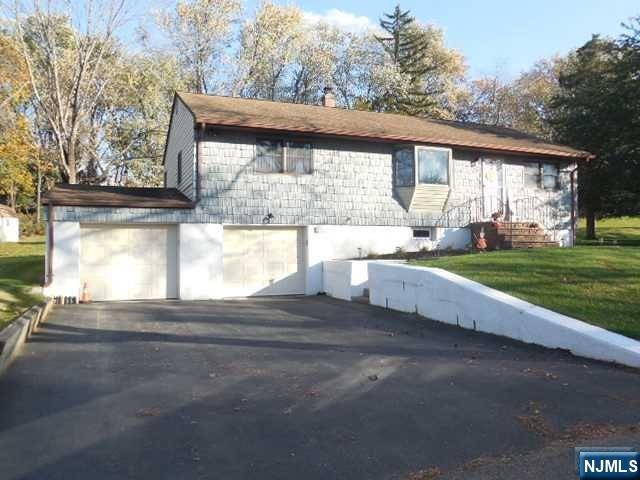Welcome to this well kept & updated Ranch with hardwood floors throughout the main level,3 spacious bedrooms,newer full bath,eat in kitchen with a breakfast bar & all stainless steel appliances.Back exterior door off of the kitchen to a large deck overlooking a spacious yard with a storage shed.Large newly finished basement with a surround sound system,tile flooring & newer 1/2 bath,newer Gas H/W BB heating system & storage area with walk out to a 2 car attached garage. Nice quiet neighborhood & conveniently located to shopping & major highways.