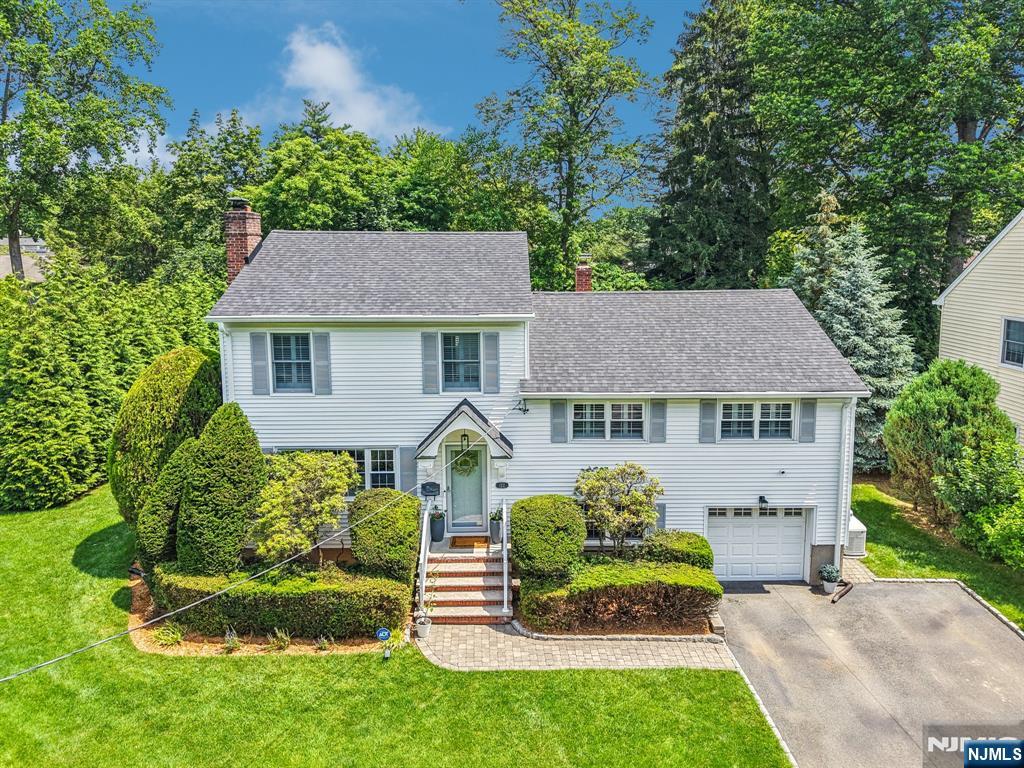 Welcome to this beautifully updated and maintained 4-bedroom, 2.5-bath home situated on a desirable corner lot. Thoughtfully designed for comfort and style, this home features a gourmet kitchen outfitted with a professional grade 6 burner range, granite countertops, and ample cabinetryâ€”perfect for both everyday meals and entertaining. In addition to the kitchen the main floor offers a generous living room with a wood burning fireplace, and dining area ideal for gatherings or quiet evenings at home. Down a few stairs there is a cozy den with garage access and a newly renovated laundry room. A few steps up from the main level is a full hall bath with tub, and three bedrooms, one with a private half bath. On its own level is an expansive primary suite that provides a true retreat with multiple closets including a walk- in and a bright en suite bath with double sinks. Elegant finishes throughout, and a functional layout, this home offers the perfect blend of space, style, and practicality. The spacious private backyard offers a perfect place for outdoor relaxing and entertaining. Other updates include the roof, generator, in ground sprinklers, tankless hot water heater and more. Glen Rock has top rated schools, a charming downtown, two train lines, beautiful parks and a town pool.