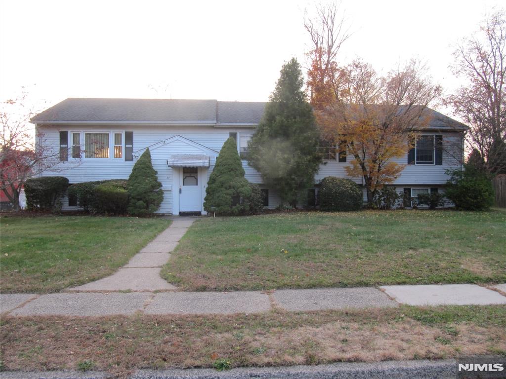 Welcome to this Large House, 5 - 6 BR, 3 FBTH, 2 car Garage expanded Bi-Level (app. 2416 sqft) in the prestigious Wayne Hills Section with a large level yard (app.100 x 150), an entertainer's paradise. Why go away when you can enjoy your fenced in Built-In pool (app.18 x 36) and a nice size yard, all on a quiet street (NO flood zone) with Municipal Water & Sewer. Close to Schools, Shopping, Parks. and Transportation. EF w/CT flr. & coat closet. HDWD frs and new w/w where installed. Ground Flr: Family rm (22-9 x 18-1) w/Dry Bar. FBTH w/CT flr. & SS. Lndry room & OE to BKYD. Rec rm / Game rm / Office / Poss. 6th BR (22-9 x 15-2) if needed / potential In-Law Suite with OE to BKYD. 2 car attached garage, 1 w/remote & xlg driveway for 6+ cars. Utility room w/4 zone gas HWBB type heat, 50 Gal. gas HTWTRHTR, 200-amp CB. 1 zone Central AC. 2 strg sheds in â€œas - isâ€ condition. First Flr: Living rm w/w carpet, Dining rm w/laminate flr., Eat In Kitchen, Hallway Linen closet, Hallway FBTH w/dbl sink & CT flr. Attic fan. BR (10 x 10-6)w/HDWD flr., PBR (12-5 x 14-6)w/pvt FBTH & ceiling fan, BR (7-8 x 11)w/Laminate flr., BR (12 x 13)w/w & Ceiling fan, BR (11-9 x 13-2)w/w & Ceiling fan. Pull-Down stairs to semi-flrd Attic for additional strg. Please note that the condition of the house was taken into consideration when pricing & was priced accordingly. Great location, just needs some updating and your finishing touches. Will not last. Priced to sell. Hurry, make your offer today!