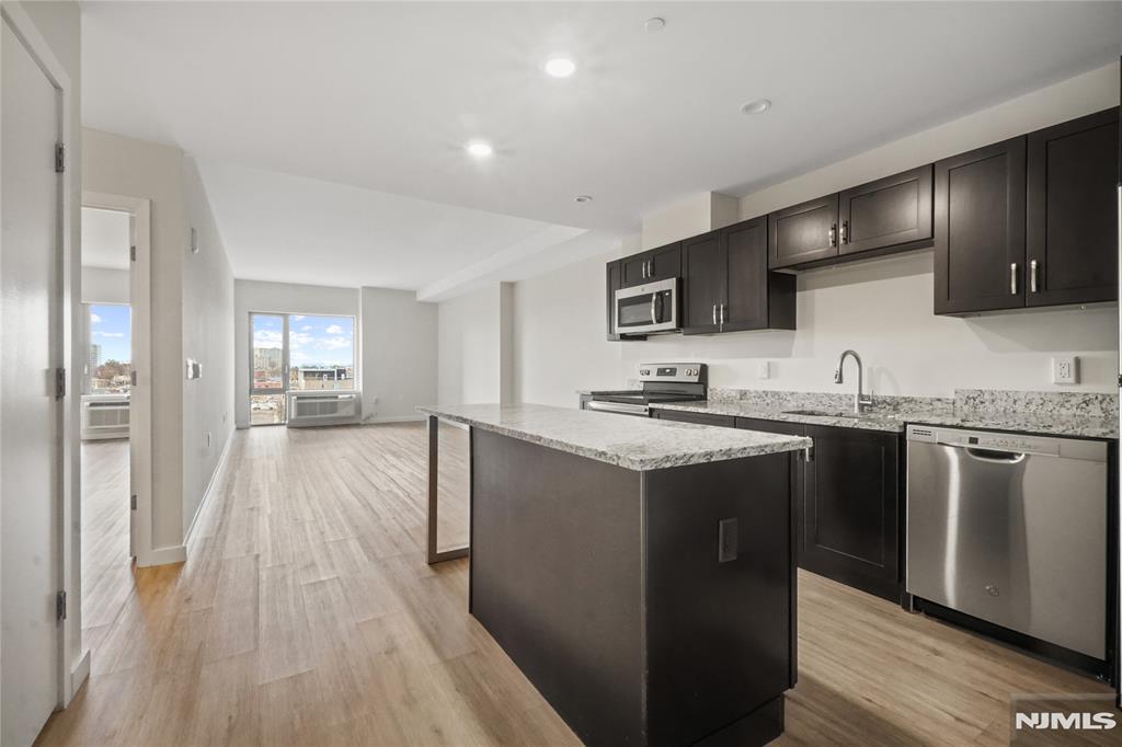 Welcome to Unit #1406, a large and beautiful 1 bedroom + den apartment featuring west exposure that fills the home with warm natural light and breathtaking sunset views. This peaceful unit offers an open and inviting layout, ideal for both living and working from home. Recently freshly painted, it provides a clean, modern feel throughout. Perfect for those seeking comfort, space, and serenity in a prime location.