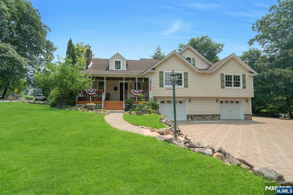 For a private showing please text Gary Silberstein @201-647-4225. Cragmere is the oldest section of Mahwah with tree lined streets and homes with character wherever you turn. A true family neighborhood with block parties, Halloween like you have never seen before, and a convenient walk to Betsy Ross elementary school. This expanded split level home offers 5-6 bedrooms, 3 full baths, oversized 2 car garage and hardwood flooring throughout. The first floor offers a living room with woodburning stove, large eat in kitchen with peninsula for the whole family, stainless steel appliances, and custom cabinetry. 2nd floor offers 3 bedrooms, laundry, and a large primary suite with access to a deck overlooking the wooded yard. 3rd floor offers a home office for the work at home professional. The 4th floor offers a large bonus room ideal for a game room or 2nd primary suite with a large full bath. The basement is unfinished and great for storage and there is a den off the garage that can be finished as a playroom, mudroom, or laundry. The side yard is large with a patio and room for a pool. Don't wait on this one and get in before school begins! Please note some photos have been virtually staged/enhanced to give buyers a visual of the room's potential.