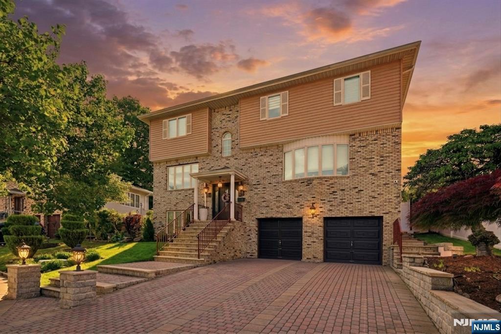 Welcome to your dream home at 54 William St! This beautifully renovated home blends luxury, comfort, and functionality in every corner. From the moment you arrive, the stunning brick facade, paver driveway, and oversized 2-car garage create incredible curb appeal. Major upgrades include a furnace, central air system, water heater, bathrooms, and kitchen. Inside youâ€™ll find a thoughtfully designed layout featuring multiple living and entertaining spaces, including a spacious living room, formal dining area, and an additional family room on the main level. The updated modern kitchen is equipped with high-end Thermador appliances, sleek finishes, and timeless style perfect for everyday living or hosting guests. The lower level offers even more versatility with a second kitchen, additional family room, and a custom wine room, ideal for entertaining or extended living arrangements. Upstairs features 4 generously sized bedrooms, including a primary suite with a large walk in closet and private bath. Step outside to your fully pavered backyard complete with a fire pit and full privacy fencing. Prime location with easy access to NYC transportation, buses, trains, parks, shopping, and restaurants nearby. This is the one youâ€™ve been waiting for, schedule your private tour today before itâ€™s gone.