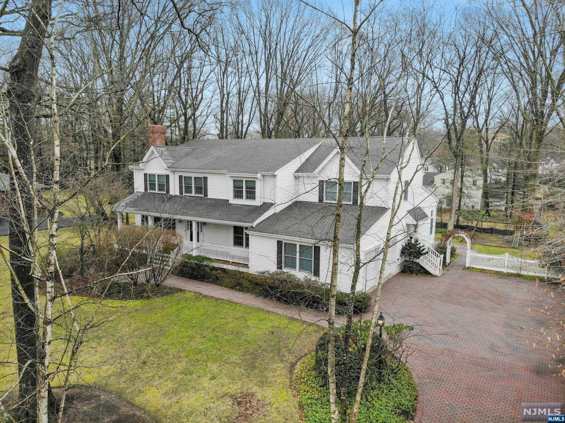 Welcome to this incredible home located on one of Demarest's most coveted streets!This rare opportunity presents a magnificent home set on a half an acre of lush landscape,boasting nearly 5,000 sq.ft.of living space with an additional finished expansive lower level.Designed for both entertaining and comfortable living,this custom built home offers a thoughtful floor plan and warmth.The 1st floor,with 9 ft ceilings opens to a large library,a cozy living room with a fireplace,and a dining room perfect for hosting gatherings.The heart of the home lies in the impressive kitchen,which seamlessly flows into a sunlit family room,creating a warm and inviting atmosphere.Ascending to the 2nd floor ,you'll find a very special primary suite featuring a sitting room,large bath,office and generous walk-in closets.Additionally the 2nd floor offers 3 more large bedrooms and 2 bathrooms.Located near Demarest's top-rated schools and the Closter Plaza, this home ensures luxury and convenience.