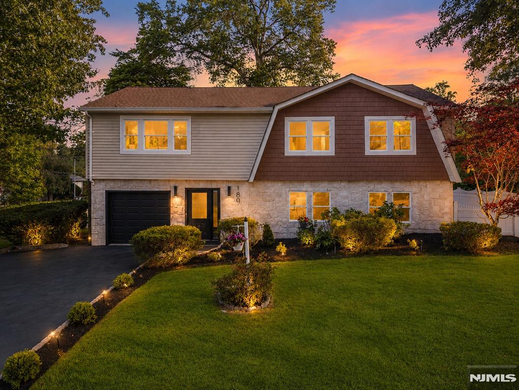 Beautifully renovated and thoughtfully designed, this 4-bedroom, 3-bath home offers hardwood floors throughout, modern finishes, and bright, functional living spaces in a desirable Westwood location. A wide, charming entrance welcomes you into the home, leading to an open-concept layout that seamlessly connects the living room, dining area, and kitchen. The stunning kitchen features custom cabinetry, quartz countertops, stainless steel appliances, and a center island. A sliding glass door fills the space with natural light and provides access to the backyard. An office and a full bathroom complete the main level. The second floor offers a primary suite with his-and-her closets and a private bath featuring a double vanity, soaking tub, and separate shower. Three additional well-sized bedrooms, a full bathroom, and a spacious family room provide flexibility for everyday living. Outside, enjoy a large backyard, detached garage, vinyl fencing, and Green Giants that enhance privacy and curb appeal. Major improvements include a new roof, HVAC system, plumbing, and electrical, providing added peace of mind for years to come. Conveniently located near downtown Westwood, shopping, dining, parks, the train station, and commuter routes to New York City. A rare opportunity to own a Move-in ready home in one of Bergen County's most desirable communities.
