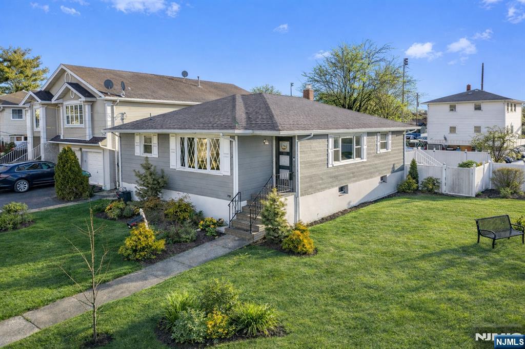 Welcome to your new home in the heart of Lodi. This fully renovated 3-bedroom, 1.5-bath home offers a modern luxury feel with every major upgrade already completed within the last 5 years. Designed with both style and functionality in mind, the home features a stunning renovated kitchen with sleek quartz countertops, stainless steel appliances, recessed lighting, and a breakfast bar area perfect for everyday living and entertaining. The spacious, sun-filled layout flows seamlessly into the living and dining areas, creating an inviting atmosphere throughout. Generously sized bedrooms include a primary bedroom that comfortably fits a king-sized bed, while the beautifully finished basement with luxury vinyl plank flooring provides additional living space, a washer and dryer area, utility room, and abundant storage. Major improvements include a newer central air and forced hot air system only 2 years old, a roof under 5 years old, and a newly paved 2-car driveway. Step outside to enjoy a large private deck and backyard with no neighbor on the right side for added privacy. Conveniently located with quick access to NYC. NOT IN A FLOOD ZONE!