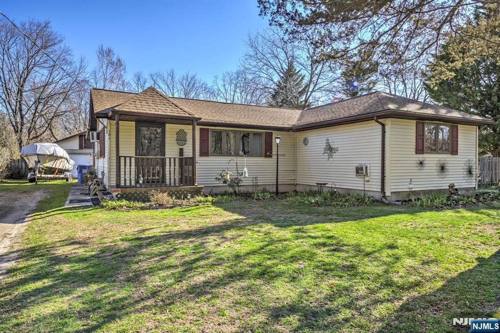 Welcome to 181 E Pleasant Grove Rd, a charming Jackson home that perfectly blends comfort and character. Boasting 1,999 square feet, this residence offers a surprisingly spacious interior. The home features 2 large bedrooms and a standout, oversized family room anchored by a cozy wood-burning stove. Set on a sprawling .92-acre lot, the property is a private oasis. Highlights include a freshly repainted deck and an open pool ready for summer. Hobbyists will love the huge detached garage, providing massive storage or workspace. Ideally located with easy access to I-195, this home is perfect for commuters seeking space and convenience. A true gem that feels much larger than your average 2-bedroom home! Schedule your tour today.