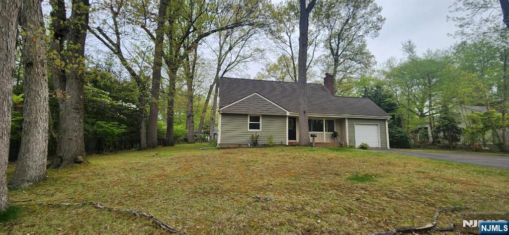 Great location on large level lot 100 x 124! Cape cod, features entry foyer, large living room with wood burning fireplace opens to large eat in kitchen. Formal dining room with entry to lovely 3 season porch. Two large bedrooms on first floor. Newer full bathroom first floor. Upstairs 2 large bedrooms and full bathroom. Fenced yard. Full unfinished basement with high ceiling, great potential. One car garage. Huge driveway with plenty of parking. A must see to appreciate!