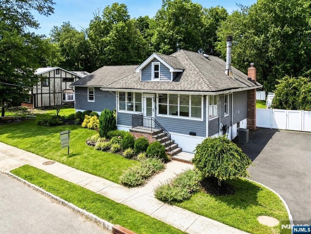Welcome to the stunning fully renovated 4 bedroom expanded ranch on an oversized lot in one of Roselandâ€™s most desirable neighborhoods. This move-in-ready home has been thoughtfully updated with high-end finishes throughout. A charming enclosed front porch welcomes you into a bright interior featuring hardwood and tile floors, a convenient laundry room, and an updated full bath. The chefâ€™s kitchen offers stainless steel appliances, quartzite countertops, a center island, abundant cabinetry, and an open layout overlooking the living and dining areas. The living room features a natural stone gas fireplace and large windows with beautiful backyard views. The spacious primary suite includes a dual vanity en-suite bath, 2 walk-in closets, and a new sliding glass door leading to the expanded rear deck. Three additional sun-filled bedrooms feature brand-new built-in closets. Enjoy a private, fully fenced backyard with mature trees, an oversized deck, and endless possibilities for a pool, outdoor kitchen, or play area. The walkout basement offers high ceilings, a French drain system, and approx. 1,000 sq ft of potential finished living space. Preexisting architect plans for a future second-story addition add even more potential. Conveniently located near Rt 280 and Garden State Parkway and within close distance of Fairchildâ€™s Market, the Library, parks, and tennis and pickleball courts, this exceptional home offers modern living, outstanding outdoor space, and an unbeatable loc
