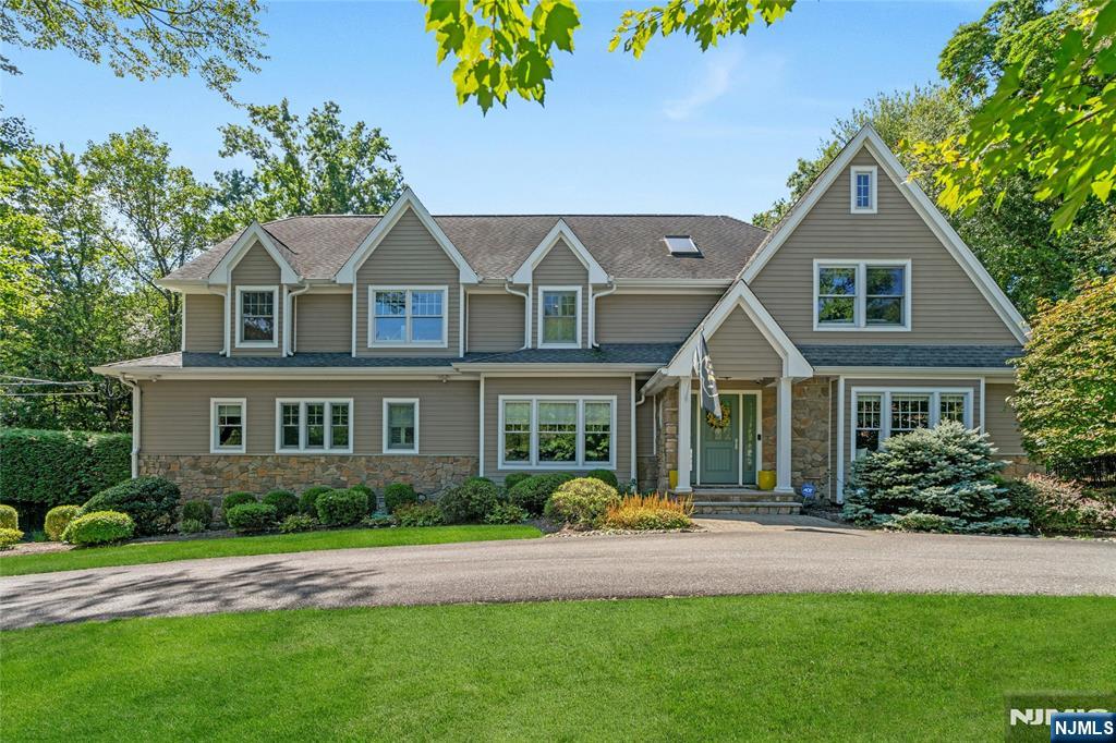 Welcome to 7 Deerhill Drive, a stunning modern Colonial offering 5 bedrooms, 5 full baths, and 1 half bath, blending timeless design with modern comfort throughout. An open-concept layout is ideal for everyday living and entertaining, featuring a gourmet kitchen with oversized island, coffee bar, and eat-in area that flows seamlessly into the inviting living room with a natural stone fireplace. Formal living and dining rooms, along with a flexible main-level space with full bath, add both elegance and versatility. Upstairs, the luxurious primary suite offers a serene retreat with an expansive walk-in closet, accompanied by three additional guest bedrooms designed for comfort and flexibility. A bonus room offers flexible space for a playroom, office, or additional lounge area. The walk-out lower level enhances the homeâ€™s appeal with a recreation area, wet bar, full bath, and access to the 3-car garage. Outdoors, a private backyard oasis awaits, featuring mature landscape, an in-ground pool, outdoor fireplace, and built-in grillâ€”perfect for entertaining and enjoying the best of indoor-outdoor living. A lifestyle waiting to be experienced!