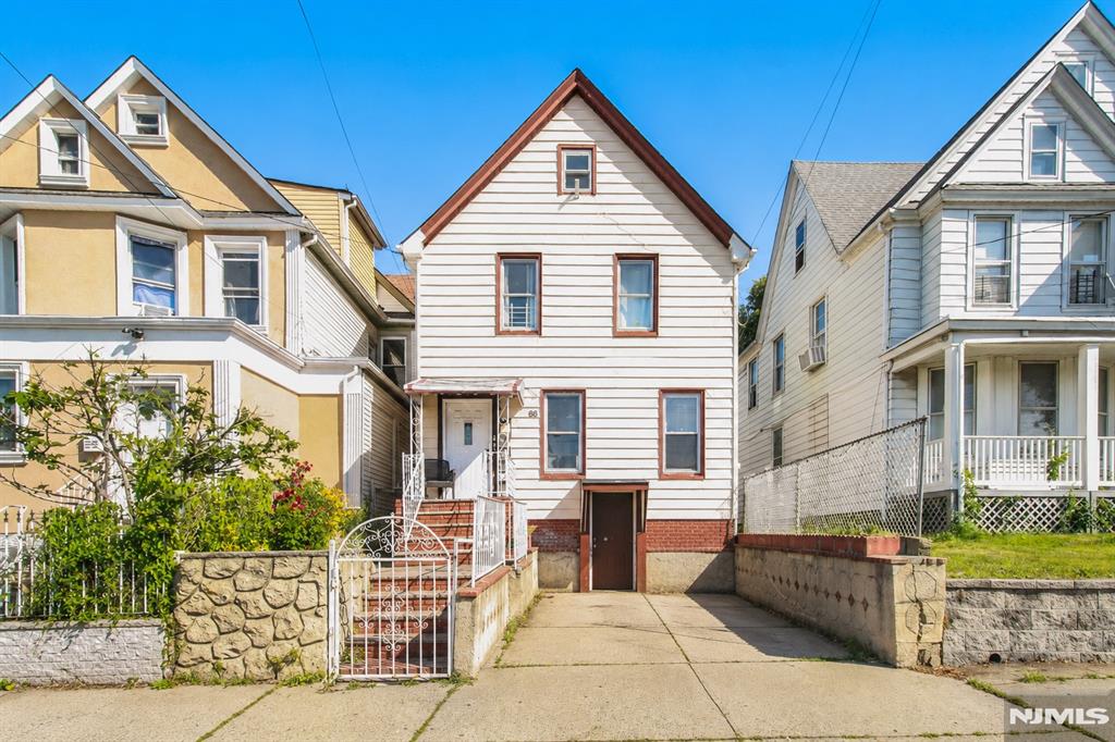 Beautifully maintained two-family home in a highly convenient location just steps from major shopping, restaurants, public transportation, and everyday amenities. Offering a total of 5 bedrooms and 3 full bathrooms, this versatile property also features a finished attic and finished basement, providing additional living, recreation, office, or storage space. Recent updates throughout make this a move-in-ready opportunity for both owner-occupants and investors. The home offers spacious living areas, updated kitchens and bathrooms, a private driveway for off-street parking, and a fully fenced backyard with patio space perfect for entertaining and outdoor enjoyment. Situated in a strong rental market with high demand, this property is ideal for first-time buyers looking to house hack by living in one unit while generating rental income from the other, or for savvy investors seeking strong cash-flow potential and long-term appreciation. A rare opportunity to own an income-producing property with flexibility, convenience, and excellent investment potential.