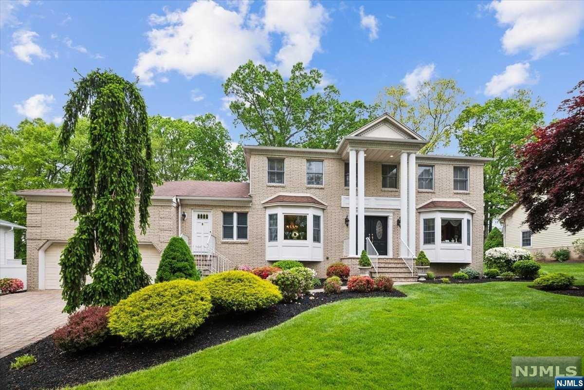 Boasting 3,700+sqf of living space, this elegant Colonial has a Mother/Daughter unit w/private entry & plenty of room for everyone. Columned front entry, /hardwood floors, crown molding, recessed lighting & more. A grand foyer is flanked by a formal dining room & living room w/French doors to a welcoming family room w/fireplace. Just beyond a gorgeous eat-in kitchen w/beautiful stone counters, SS appliances & a breakfast nook w/backyard vistas. Main floor mother/daughter unit has an eat-in kitchen, living room w/front entry, 1 bed, bath w/access to the main-floor laundry. Upstairs you'll find a primary suite, luxurious bath w/custom tile, dual quartz-topped vanity, clawfoot tub, separate shower & WIC. 3 more bedrooms are serviced by a full hall bath. Partially finished lower level offers a rec-room, bonus room ideal as an office or gym, huge storage space plumbing for another bath. Sprawling deck overlooks a flat backyard.Standby generator included. Move-in ready, unpack & enjoy!