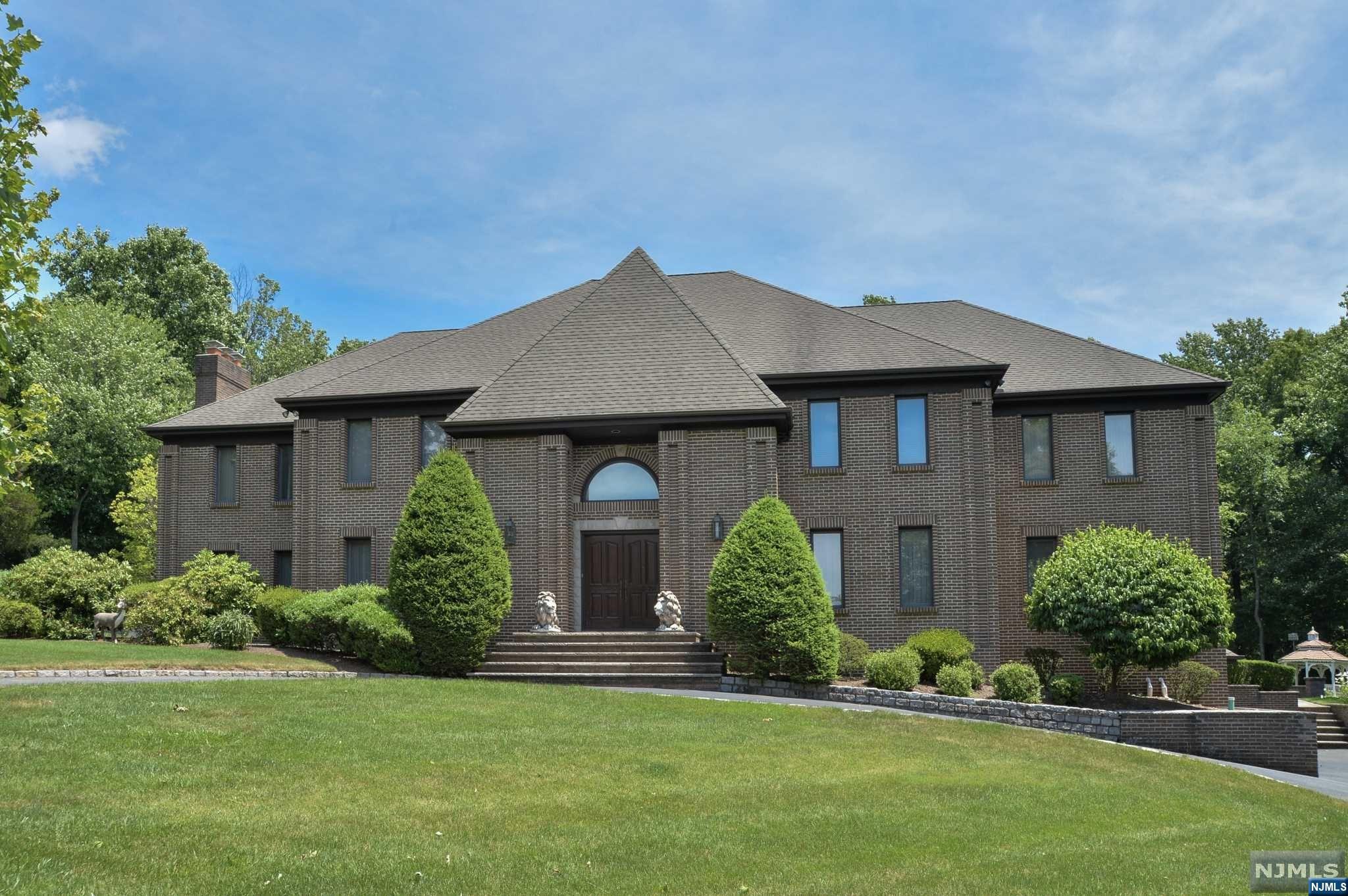 A Chestnut Ridge Road gated & fenced estate of almost 5 acres offers the most impressive drive up to this 6 bedroom all brick manor. The exterior amenities include a heated inground pool, an outdoor kitchen under a covered pavilion, gazebo, storage outbuilding, stables and firepit. Generac generator, rolling lawns for gracious entertaining. Please do not walk the property without prior appointment as the home is currently occupied.