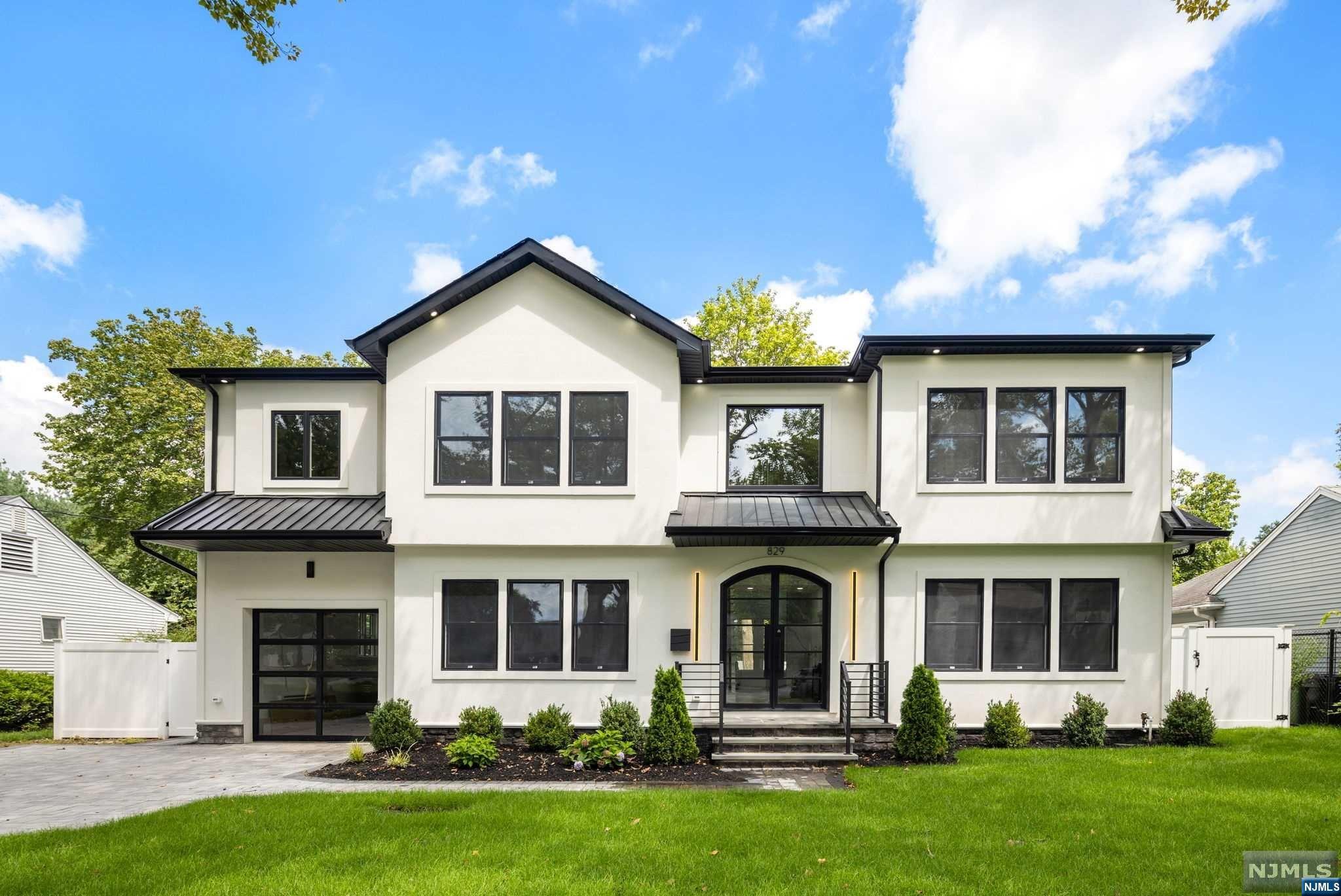 Welcome to home sweet home! This stunning property boasts a six-bedroom, six-bathroom layout with a finished basement on a sprawling 75x125 lot size. Sleek, modern exterior with the white and black accents truly enhance its curb appeal! The home is crafted with top-of-the-line materials and features custom finishes that exude sophistication and elegance. The designer gourmet kitchen w/ huge center island and high-end quality bathrooms are perfectly complemented by an easy living floor plan with double story foyer and great room, making this neighborhood an ideal place to call home. Guest suite on the first floor and bonus bdrm w full bath in the basement. Located in Paramus, residents will enjoy access to excellent schools, shopping centers, recreational facilities, and easy commuting options via major highways to nearby cities or towns.