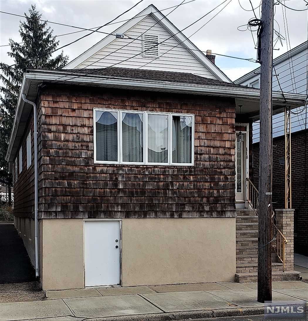 This super clean 2 bedroom 1 full bath ranch style home complete with hardwood flooring, large living room, dining room and full finished basement. This home is a great condo alternative with a one car detached garage and is walking distance to NJ Transit bus and NA schools. The are wall AC and the home is heated by gas and has a 3 zoned baseboard heating system. THIS HOME HAS A SHARED DRIVEWAY.