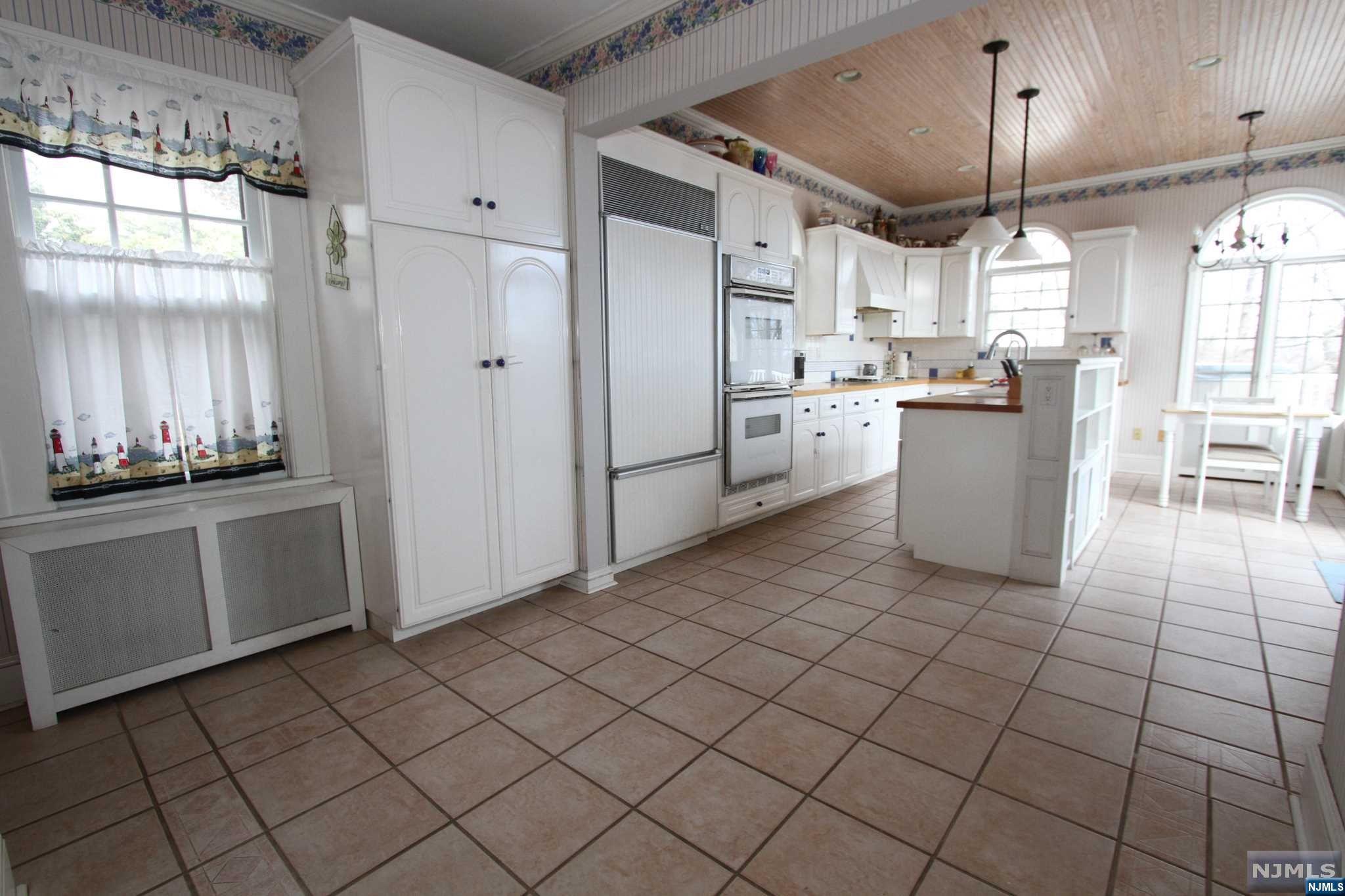 Come see this Entertainers delight in the Heights! This wonderful home offers so much charm w/ its original wood floors and moldings.It has a great flow starting in the spacious Living rm w/a wood burning fireplace. The Dining room takes you into a large,bright kitchen with a high ceiling, The French door leads out to a huge 2 tier composite deck, complete with Hot tub and pool! The Large,deep lot offers both privacy and potential! The 2nd Fl offers good size bedrooms, a full bath and lots of closets!