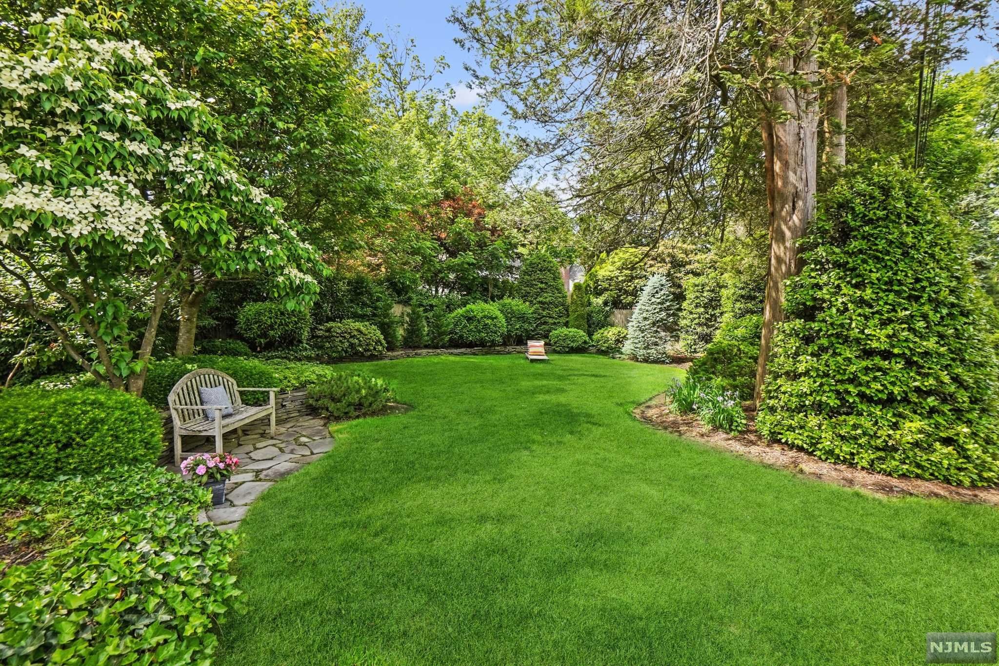 Oodles of charm in every room of this delightful Center Hall on one of Upper Montclair's favorite streets. You'll love all the details - arched doorways, custom built-ins, and large windows that invite in tons of light. Four corner bedrooms on 2nd Floor with updated baths and hardwood floors under carpeting. Eat-in kitchen has Sub-Zero fridge, new Miele dishwasher, mudroom and convenient door to patio for grilling ease. Adorable craft room plus rec room on lower level. Full house generator, central air and 2019 furnace. Close to both Yantacaw and Brookdale Parks filled with playgrounds, tennis court and dog park. If you can, tear yourself away from your own serene, expansive, private, fully-fenced backyard with blue stone patio (so green & lush)! With 6 bedrooms there's plenty of space for home office options. Everything you need for today's hybrid lifestyle, inside and out.