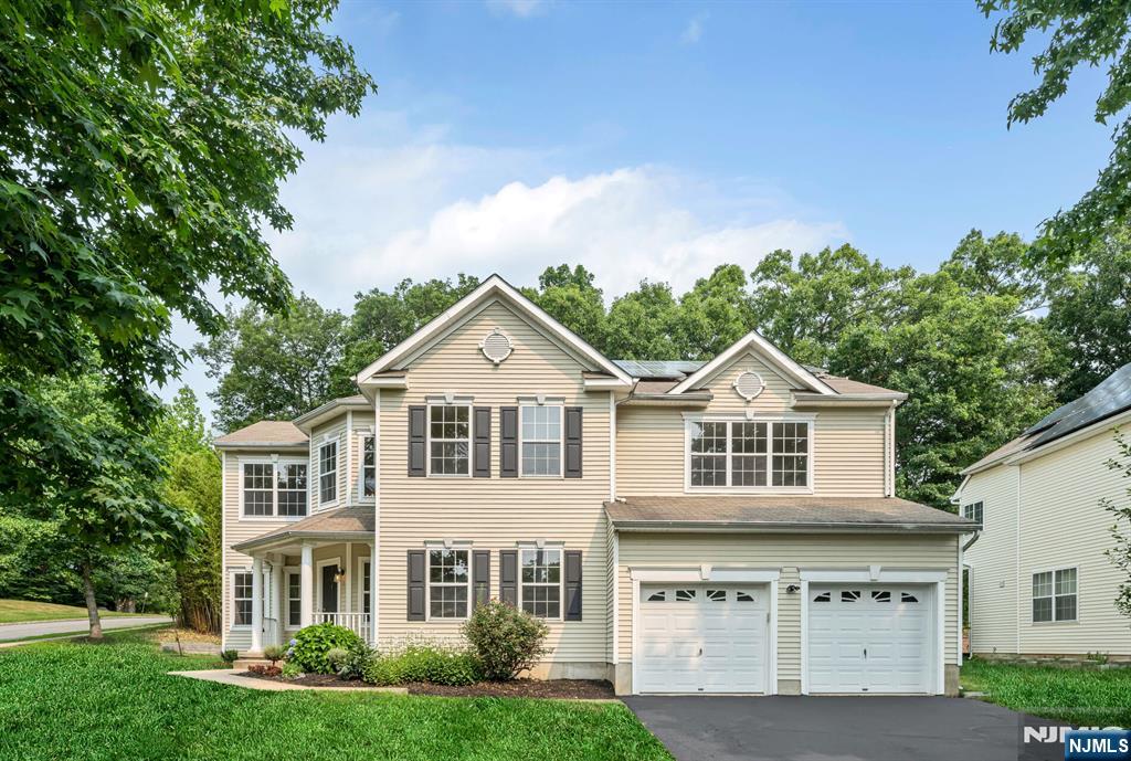 Introducing a very special luxury property where everything is NEW. Welcome to an exciting and unique opportunity to experience a complete home renovation where every design element is brand new as of June 2026 and has never been lived-in since, resulting in a fabulous modernized colonial which presents like new construction. This stunning home has just been reimagined and fully elevated with fine quality finishes desired by today's most discerning buyers. Professionally remodeled throughout featuring: NEW KITCHEN, NEW BATHS, NEW FLOORING, NEW FINISHED BASEMENT, NEW PAINT PALATE, NEW PATIO & NEW LIGHTING/FIXTURES. Step inside an inviting interior with an award winning floorplan offering a calming atmosphere of comfort and style for living, entertaining and working from home. Glamorous chef's kitchen features all high end appliances including professional range hood and drawer microwave. Primary bedroom suite includes a sitting room, dual walk in closets and exquisite spa-like marble ensuite bath. Secondary baths are also stunning in all design elements. Finished basement with flex space and storage offers three full levels of living here. Situated on a wooded corner lot with a custom built patio on undoubtedy the most private and serene streets of the Peaks community. PUBLIC UTILITIES are here and are another desirable feature in this community of homes. The WOW factor exists at every turn...elegant, welcoming and absolute move in ready for one lucky buyer to call HOME!