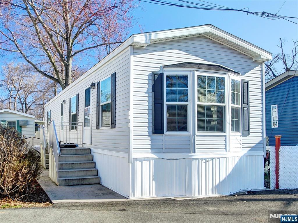 Affordability exists in Northern NJ! This newer mobile home has all the comforts you need for a carefree, easy lifestyle. Located in Vanguard Park site with easy access to Route 17 and loads of shopping and restaurants nearby. This one bedroom mobile unit offers a nice sized bedroom, open kitchen with island for plenty of prep space and washer as well as a side yard for outdoor space. Buyer must obtain financing for a mobile home and be approved by Vanguard Associates. The $875/month park lease includes taxes, water and sewer as well as snow removal. No pets allowed. No rentals allowed, must be owner occupied.
