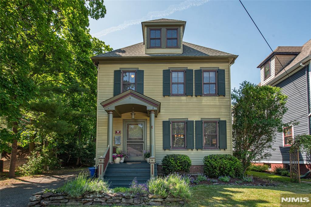 This home doesn't just have charm & character. It has a personality! Just steps from Grover Cleveland Park, this storybook Folk Victorian is filled with the architectural details buyers dream about! Stained glass, original built-ins, crown moldings, soaring ceilings & a stunning staircase. These features are rich in charm & impossible to duplicate! Living room welcomes you in with warm wood floors underfoot, built-in bookcases & wide crown moldings, opening seamlessly to the formal dining room. The triple window alcove & beadboard wainscoting are pure architectural poetry. The custom kitchen features Viking range, soapstone counters, butcher block island, tin ceiling & built-in dining nook. A screened porch leads outside to a private patio with fire pit & 2-car detached garage with electricity. Upstairs, the primary bedroom offers 2 closets & crown molding, an updated full bath with subway tile + 2 additional bedrooms and an office! A walk-up attic with high ceilings adds tremendous flexible bonus space. The finished lower level family room rounds out the footprint beautifully. Located just outside Downtown Caldwell shops, restaurants, schools & NYC transportation! One of the best things about living in The Caldwells is having Grover Cleveland Park practically in your backyard offering scenic pond views, fishing & skating plus walking,hiking & biking trails & playground spaces! Just one visit to this home & you'll understand why it is so special!
