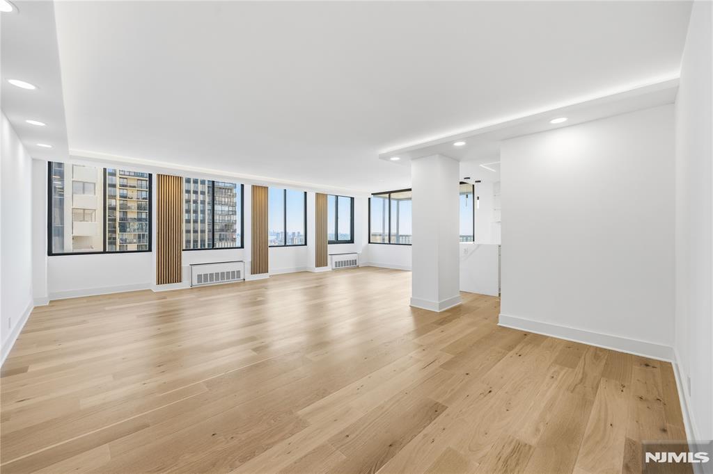 Welcome to 300 Winston Drive, Unit 2617, a fully renovated 2-bedroom, 2-bath residence offering 1,533 square feet of thoughtfully designed living space in Cliffside Park's sought-after Winston Towers. This high-floor home features hardwood floors throughout and a spacious open layout that maximizes light and functionality. The modern kitchen is equipped with a built-in oven and stove, sleek cooktop, and ample cabinetry. An LED accent wall at the entrance and LED cove lighting throughout provide a clean, contemporary ambiance. Both bathrooms are updated with modern, elegant finishes and fixtures. Located in Bergen County with convenient access to major commuter routes, shopping, and dining, this condominium combines comfort, style, and practicality in a well-established high-rise community. This property is offered for sale.
