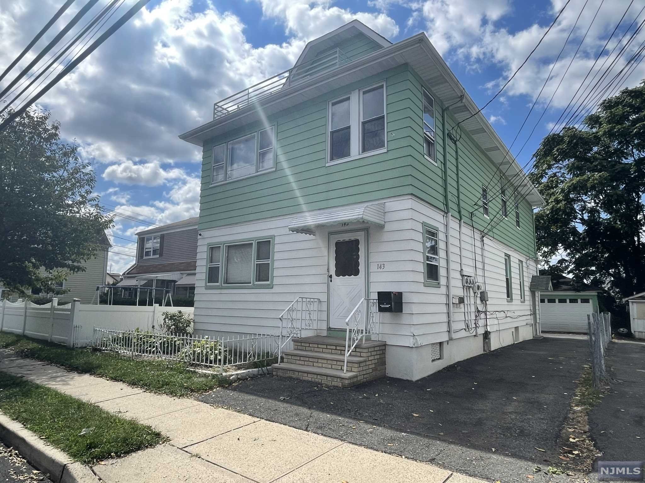 Legal three family home with two vacant units ready for a new buyer to occupy or investor to rent! Each unit has two bedrooms and 1 bathroom. Large driveway with oversized two car detached garage. Unit 1 & 2 has additional enclosed porch in the front and balcony in the rear of the unit. Laundry hookups are located in the basement.