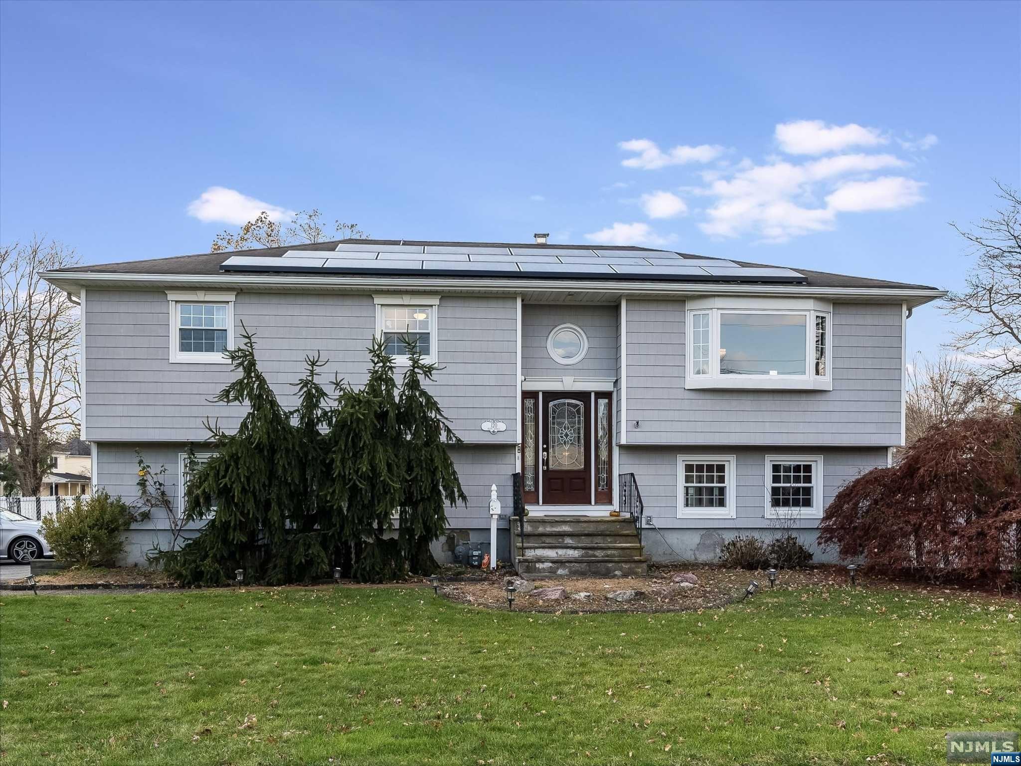 Gorgeous, fully updated bi level with a fantastic location, no flood zone! Step into the entry foyer of the home and up to the main level, which offers an open floor plan with lots of natural light. The main level of the home features a living room, dining room, beautiful eat in kitchen with center island, 3 season room, full bathrooms and 3 spacious bedrooms, including the master suite with its own bathroom. Downstairs, the ground level of the home has a den with wood burning fireplace, an office, half bathroom with laundry area, and another 3 season room with French doors leading out to the backyard. Outside the nicely sized, fenced in backyard is perfect for entertaining or relaxation. This home also offers an attached 2 car garage, solar panels, and close proximity to all major highways, schools, park, etc HVAC updated in 2020 and boiler replaced in 2021.