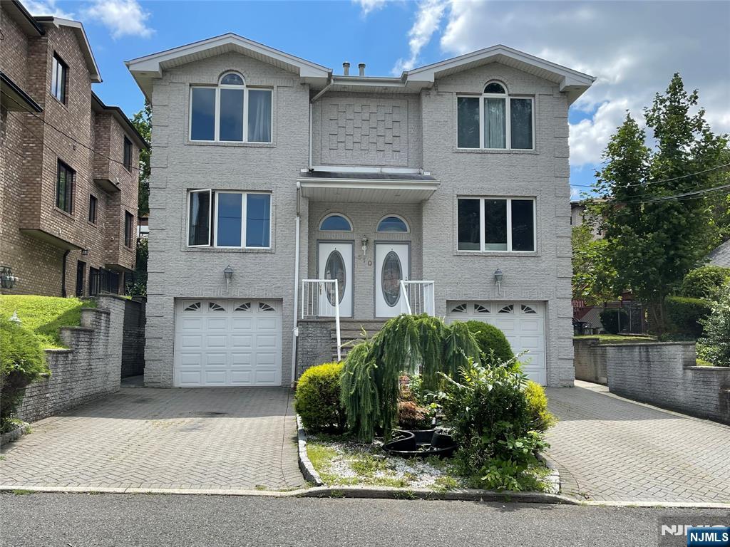 This exceptionally bright duplex is situated in a desirable residential neighborhood. It boasts beautiful tile floors, an open layout combining the living room and dining room, and an eat-in kitchen with a breakfast area that leads to a backyard. The first floor also includes a washer/dryer and powder room. The second floor features a spacious primary bedroom with a primary bathroom, as well as two additional bedrooms and a full bathroom. The additional bedroom/studio room on the ground floor has a full bathroom, a kitchenette, and separate entry. The property is equipped with central air conditioning, a single-car attached garage, and a parking space on a paver driveway. Tenants are responsible for all utility expenses and snow removal. The duplexâ€™s convenient location allows for easy access to schools, bus stops, shops, and restaurants. It is situated within minutes of New York City, close to parks, and major highways. The propertyâ€™s owner holds a New Jersey real estate license.