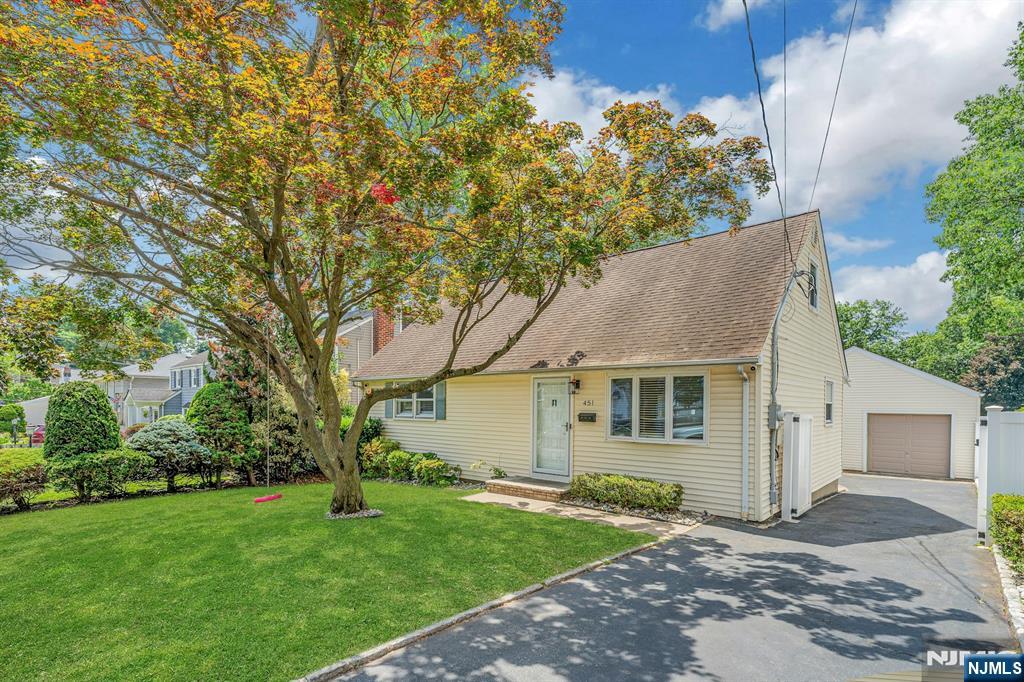 Spacious 4 bedroom cape cod with 2 car garage & driveway located in the Radcliffe School District! 1st floor has living room, modern kitchen with dining area, huge family room approx 13' x 23' and full bathroom. 2nd floor has 2 bedrooms. Kitchen w/dishwasher, refrigerator & built in range has granite countertop and tiled backsplash. Full unfinished basement with half bathroom, laundry hook ups (includes washer & dryer) and lots of storage. Gas forced hot air heat and central air conditioning system. 2nd floor has window ac. Updated 200 amp electric. Detached 2 car garage with electric door opener and stairs leading to attic storage! Long driveway can accommodate additional cars. Privacy fencing surrounds a terrific back yard. 1/2 block to bus stop- be in NYC in under 50 minutes! Not in a flood zone.