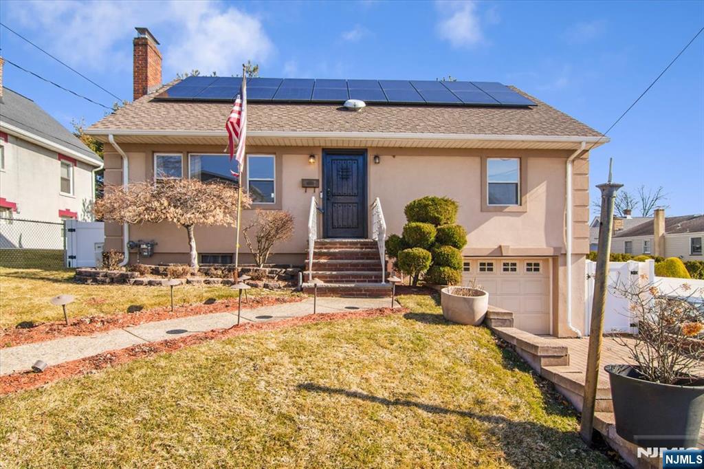 Welcome to 565 Center Street in the heart of Wood-Ridge NJ. A spacious and well-maintained home offering comfort, flexibility, and a very rare oversized property! This expanded Cape-style residence features four generously sized bedrooms and two full bathrooms, providing plenty of space for living, working, and entertaining. Tons of natural light flowing throughout the entire home. The main level offers a living room, an inviting eat-in kitchen, & well-proportioned bedrooms, while the upper level provides additional private living space ideal for bedrooms, a home office, or guest accommodations. Brand new hardwood floors installed in the entry foyer & bedrooms. The home also includes a partially finished basement offering extra recreational space, storage, or future potential. Set on a unique double lot, the property features a large backyard perfect for pets, outdoor gatherings, gardening, or expansion possibilities. Additional highlights include solar panels for energy efficiency and ample off-street parking. Conveniently located near schools, parks, shopping, and NJ Transit with easy access to major highways and a short commute to NYC. A rare opportunity to own a versatile home with exceptional outdoor space in one of Wood-Ridge's most desirable residential neighborhoods. FYI sale comes with 2 lots! Buyer would be responsible for both annual tax amount for Lot 12.01 & 12.02 (565 Center st & 56 Columbia st.)