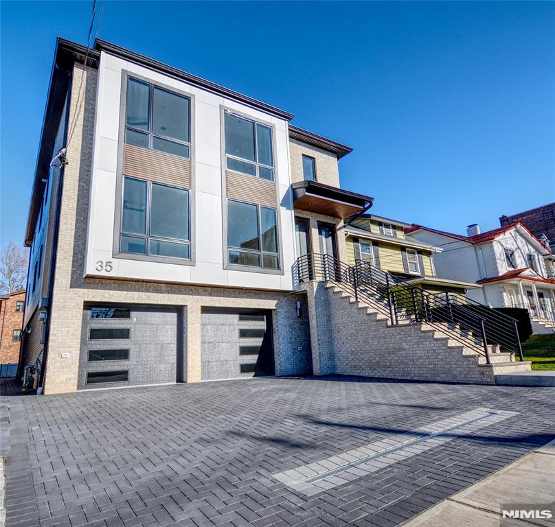Discover this stunning 2 family home in the heart of Palisades Park, thoughtfully crafted with high-end finishes and a sleek, modern design. This second-floor unit features three generously sized bedrooms and 2.5 bathrooms. Designed for both comfort and style, this property provides unmatched convenience with easy access to shopping and effortless transportation to NYC.