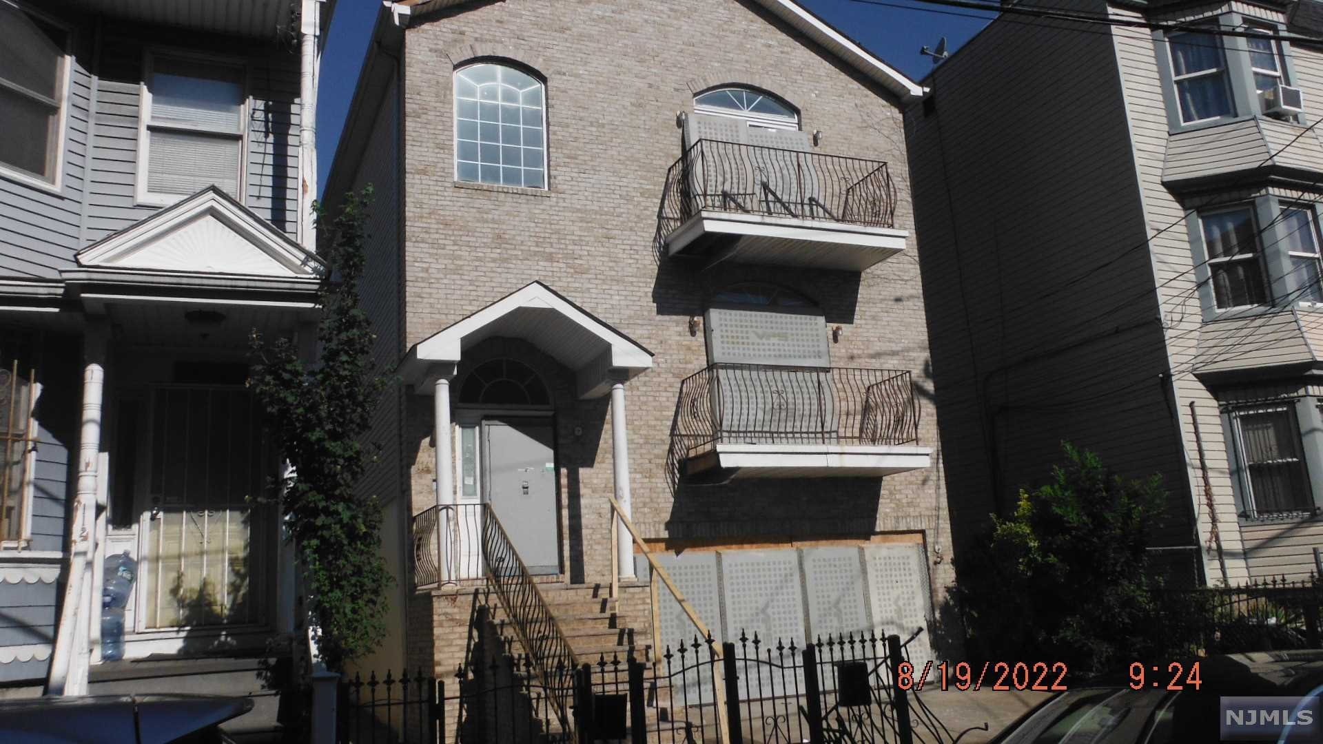Three family sold strictly "AS IS". The ground floor has 1.5 baths and two bedrooms, second and third floor have three bedrooms and two full baths. Two-car garage and sprinkler system. Across the street, a new school will be opening shortly. Easy access to highways and bus transportation, and local shopping