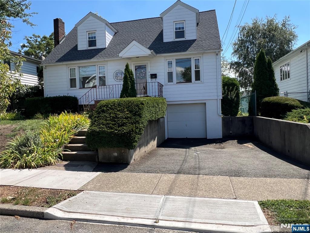 Bright and spacious home in Fair Lawn Home offers 4 Bedrooms and a spacious Den. Features include Large Living room with wood-burning fireplace, formal Dining room with built-ins. Eat in kitchen with granite and door to 3 season porch, 2 bedrooms and updated bath. 2nd floor features - 2 bedrooms and a large den, full bath. The basement is full and finished with Family Room, utility room and entry to a garage. Private backyard. Amenities hardwood floors, newer appliances and newer roof. close to school, close to town pool and park