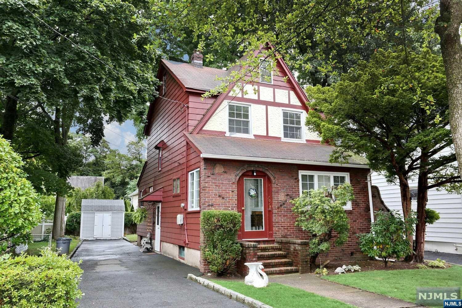 Charming, well maintained Tudor Colonial on a quiet street. A very large LR, Large DR, MEIK, Large MBR with Full Bath make up the first floor. The second floor has two large Bedrooms and a Full Bath Room. Full unfinished attic with a walk up staircase. Full unfinished basement. 2-3 car driveway