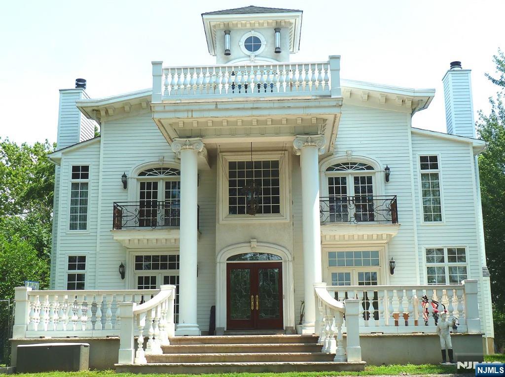 Luxury Riverfront colonial, on 2/3 acre of scenic private property. Indiana limestone floors and 20 ft columns. Grand Front Porch welcomes everyone. Living Rm with fireplace. Hand painted Venetian walls & Dining Room with fireplace. French Doors to the grand porch; great for gatherings. Entertaining Room with upholstered velvet wall. Wet bar with a wine refrigerator. Gourmet kitchen offers gorgeous marble flooring; Dacor, Subzero, Miele brand appliances. Wall coverings with hand painted paper from France and imported Italian marble counter-tops. Master Bedroom with fireplace. Upholstered wall coverings and French doors open to a balcony with an exquisite river view. Master Bath with lime stone artistic tile and hand painted mural provides fine finishing.