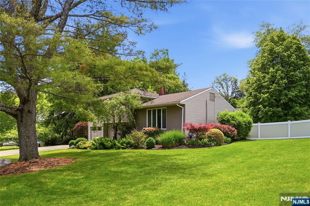 Welcome to this beautiful updated and maintained Split Level home in Prime neighborhood. Spacious entry foyer w/ large walk-in close, renovated powder room, Great room w/electric Fireplace split C/A & heat & SGD to patio, deck and lush fenced in yard. Basement is finished for additional living space & laundry room. Living Room, Dining Room w/double doors to composite deck. Renovated open kitchen w/S/S appliances, lots of cabinets and counters. Primary Bedroom w/2 closets and two additional bedrooms all with hardwood floors. GHWBB 3 zone heat. C/A, U/G sprinklers multi-zone. You will not be disappointed.