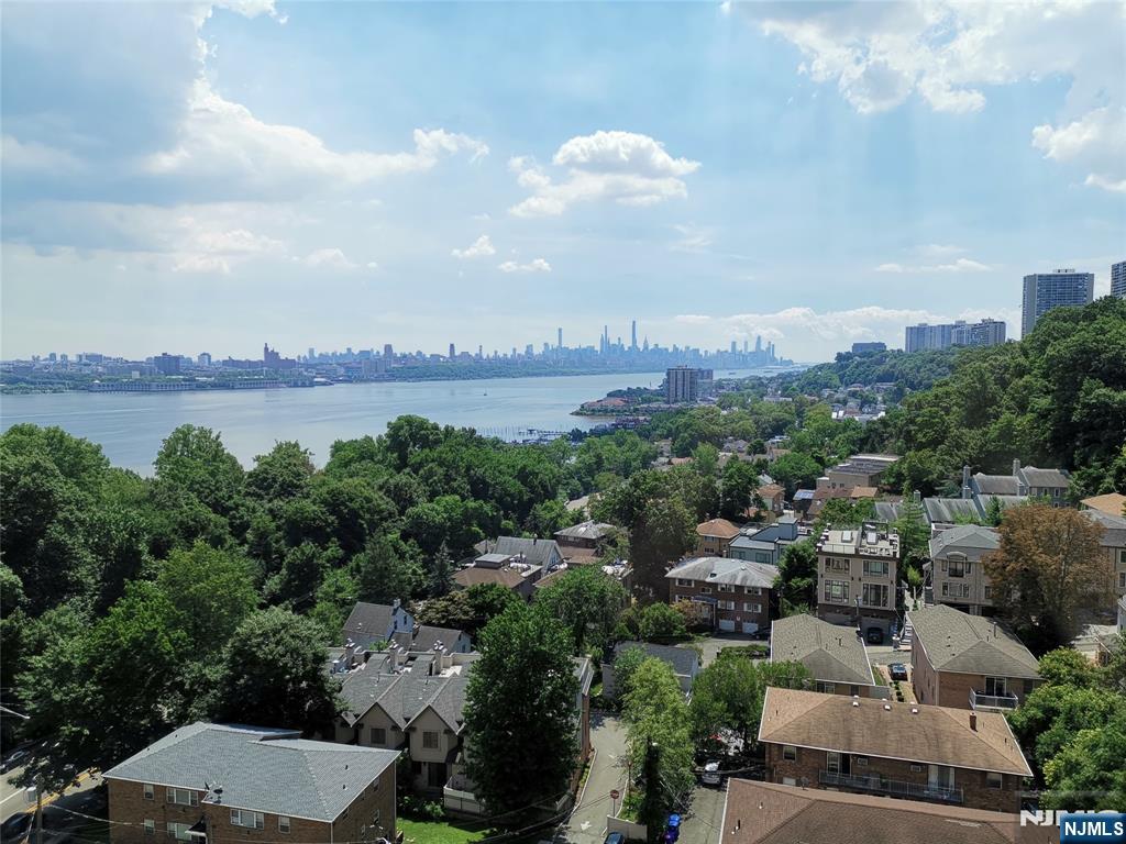Welcome to this beautiful 2 bedroom, 2 1/2 bathroom in The Palisades where the panoramic views of the iconic NYC skyline and the serene Hudson River greet you from every room. Beautiful "10" line, corner end home that just 1 floor above the lobby and close to the stairway. Located in this sought after building in Fort Lee, this home offers the perfect combination of comfort, convenience and luxury living. 24 hour concierge and doorman, visitors valet parking, fitness center, pool, community room, children's playroom, dog park, BBQ area, courtyard/deck with tables and chairs facing NYC views. 2 indoor parking spaces included. Washer/Dryer in the unit. Close to all NYC transportation, restaurants and highly rated school #1. Make it your home!