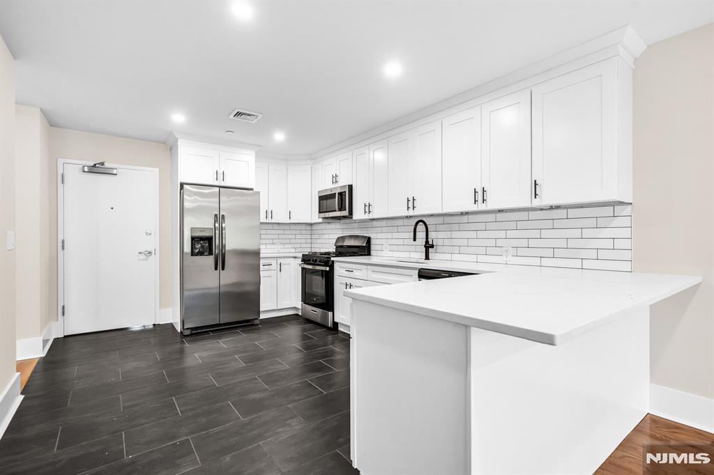 Beautiful units built in 2025 in the highly desirable town of Closter, NJ! These beautifully designed units each offer 1 spacious bedroom with a large walk-in closet featuring ample storage and custom shelving, as well as 1 elegant bathroom with high-end tile finishes. The open-concept living spaces are filled with natural light and showcase gleaming hardwood floors throughout. The modern kitchen is a true highlight, featuring white cabinetry, stainless steel appliances, quartz countertops, and a classic subway tile backsplash. Each apartment includes the luxury of an in-unit washer and dryer, central air conditioning, and one assigned parking space. A small pet may be considered. Tenants are responsible for all utilities, as well as providing proof of income and a credit check. Don't miss this exceptional rental opportunity in one of Bergen County's most sought-after communities.