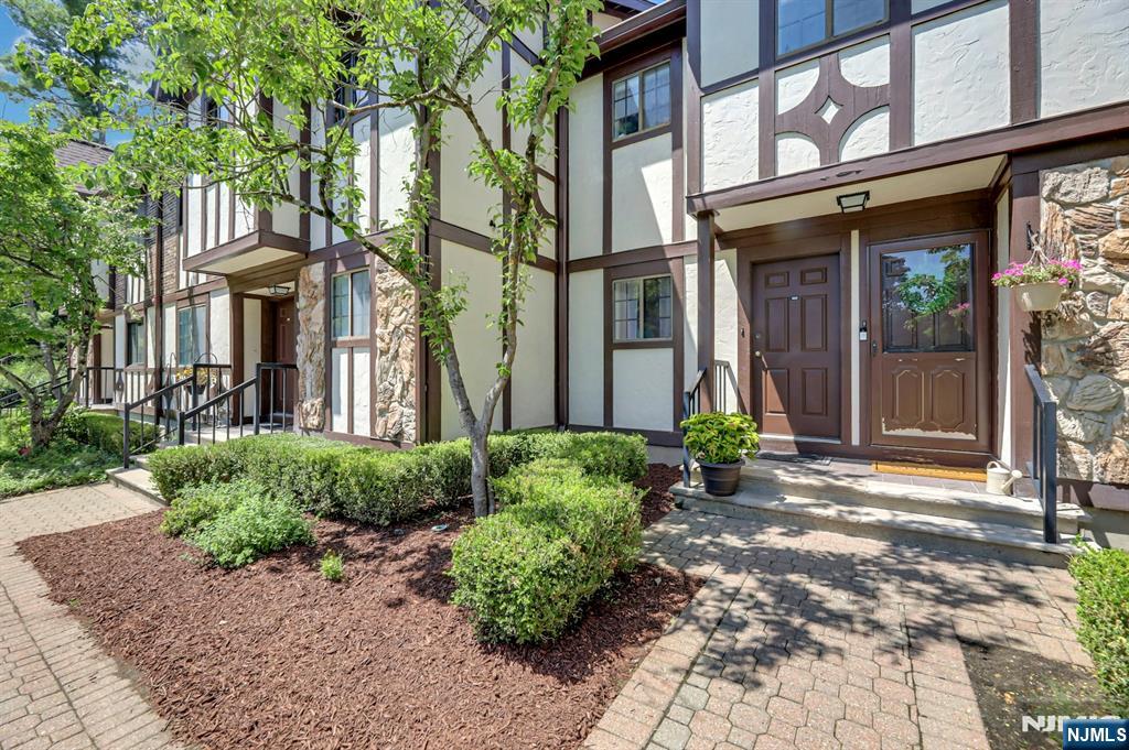 Welcome to 505 Mark Twain Way in desirable Ridge Gardens, where comfortable living, peaceful surroundings, and the ease of condominium ownership come together in one inviting home. Step inside to one of the home's most appealing features - its spacious living room, offering more room than many buyers expect to find in a condominium of this size. A wood-burning fireplace adds warmth and character, while sliding doors open to a private deck overlooking tranquil woods. The dining area provides an inviting setting for everyday meals or entertaining, and the bright kitchen features abundant cabinetry, generous counter space, and new stainless-steel appliances. The primary bedroom offers a comfortable retreat, while the second bedroom is ideal for guests, a home office, or hobbies. Recent updates include the HVAC system, furnace, and kitchen appliances, providing added peace of mind to the new owners. Lovely pool, and tennis and pickleball courts. Conveniently located near shopping, dining, parks, major highways, and NJ Transit. Come fall in love â€“ but hurry!