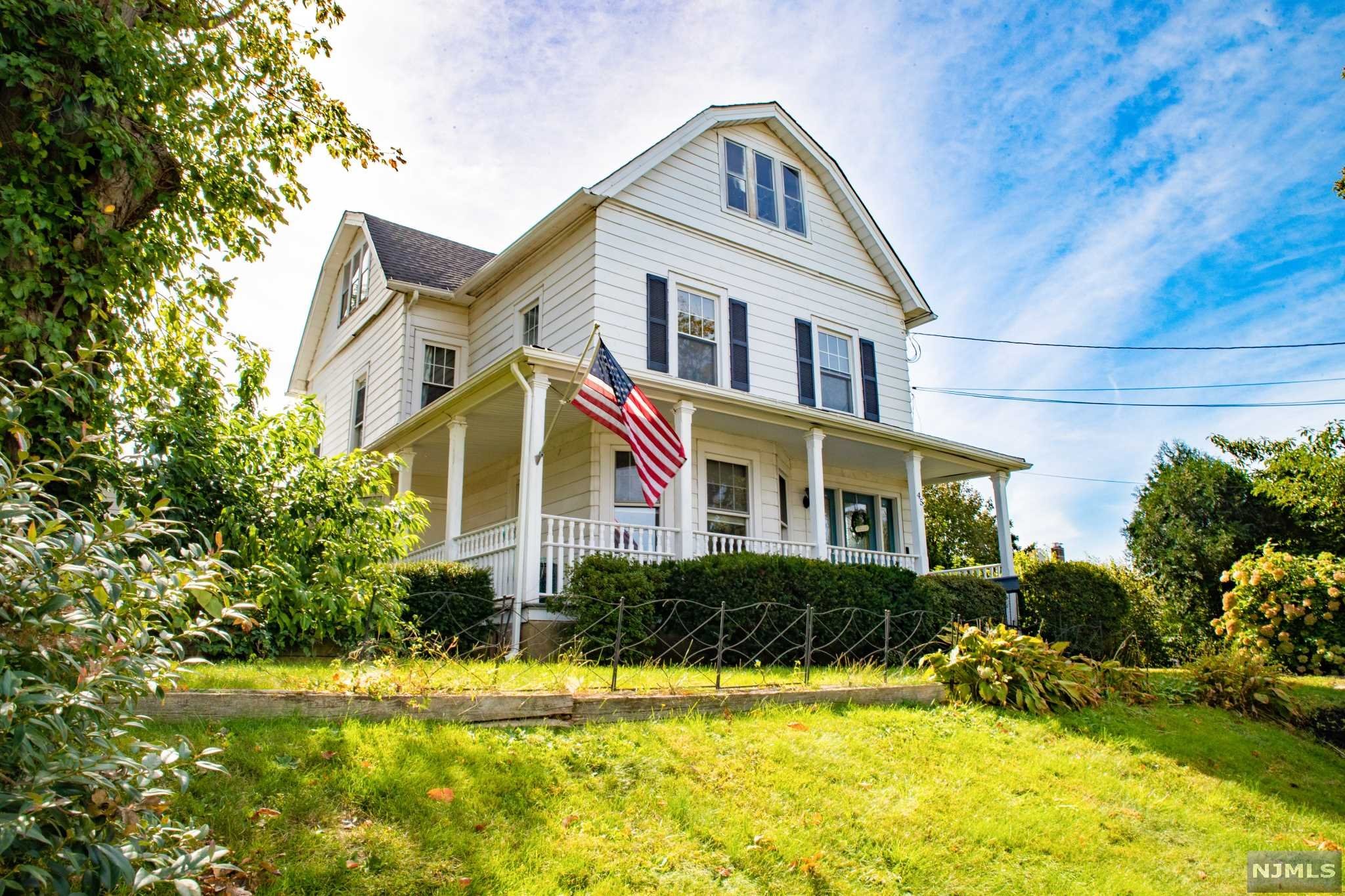 Beautifully updated large colonial home on a massive lot! Exterior offers a charming wrap around covered front porch and a beautiful front yard! The entrance foyer leads to the living room, kitchen and dining room on the first floor all freshly painted with gleaming hardwood floors! The first floor also offers an expansive updated master bedroom with brand new flooring, a large updated master bath with stall shower and laundry and a second bedroom with entrance from family room currently being used as a massive walk-in closet! Upstairs offers 4 more bedrooms with large full bath with stall shower/separate tub! Additionally there is a full walk up attic that could potentially be finished offer for even more space! The full basement is partially finished with the third full bath with stall shower! The backyard offers a huge detached two car garage with 10ft doors and cinderblock construction! Beautiful in-ground liner pool, deck and a level yard perfect for entertaining! Must See!