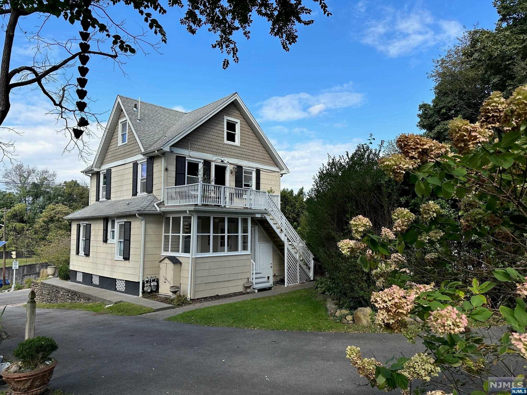 Sophisticated, fun & updated 2-family home located on 2 separate deeded lots. 453 and 457 South Broad Street. 1st floor apartment large open kitchen, 2 bedrooms, large full bath, sunroom and private laundry in basement. 2nd floor apartment is a duplex on two levels 2nd and 3rd floor. Large open kitchen, living room, laundry room, bedroom, bathroom, large outdoor deck off kitchen. Living room stairs to 3rd floor with office loft, full bathroom and bedroom. All utilities, interiors and exterior renovated and updated. Separate new electrical systems, separate new hot water tanks and newer baseboard hot water heat. Electric car charging station. Newer roof and gutters, and newer front porch and columns. All bathrooms and kitchens renovated. Fenced-in area on property, large gardens with mature trees. Walk to downtown Glen Rock or Ridgewood with restaurants, trains and shopping. Blue ribbon school system. Homeowner licensed real estate agent. A must see!