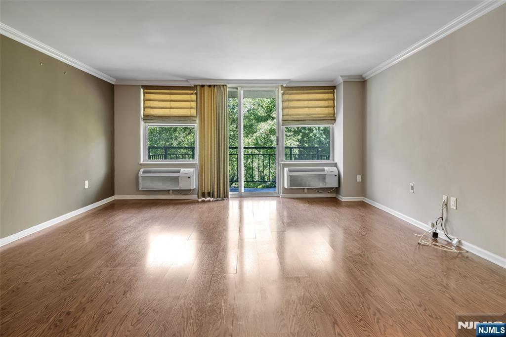 Unusual corner unit with 2 private balconies overlooking the river and pool. This unit is for the most discerning buyer. Updated kitchen and baths in recent years. All appliances are 3 months young! Heating units are 2 to 3 years young. State of the art gym and clubhouse was redone just a few years ago. Enjoy tennis and inground pool. New York transportation via bus and train minutes from your doorstep.
