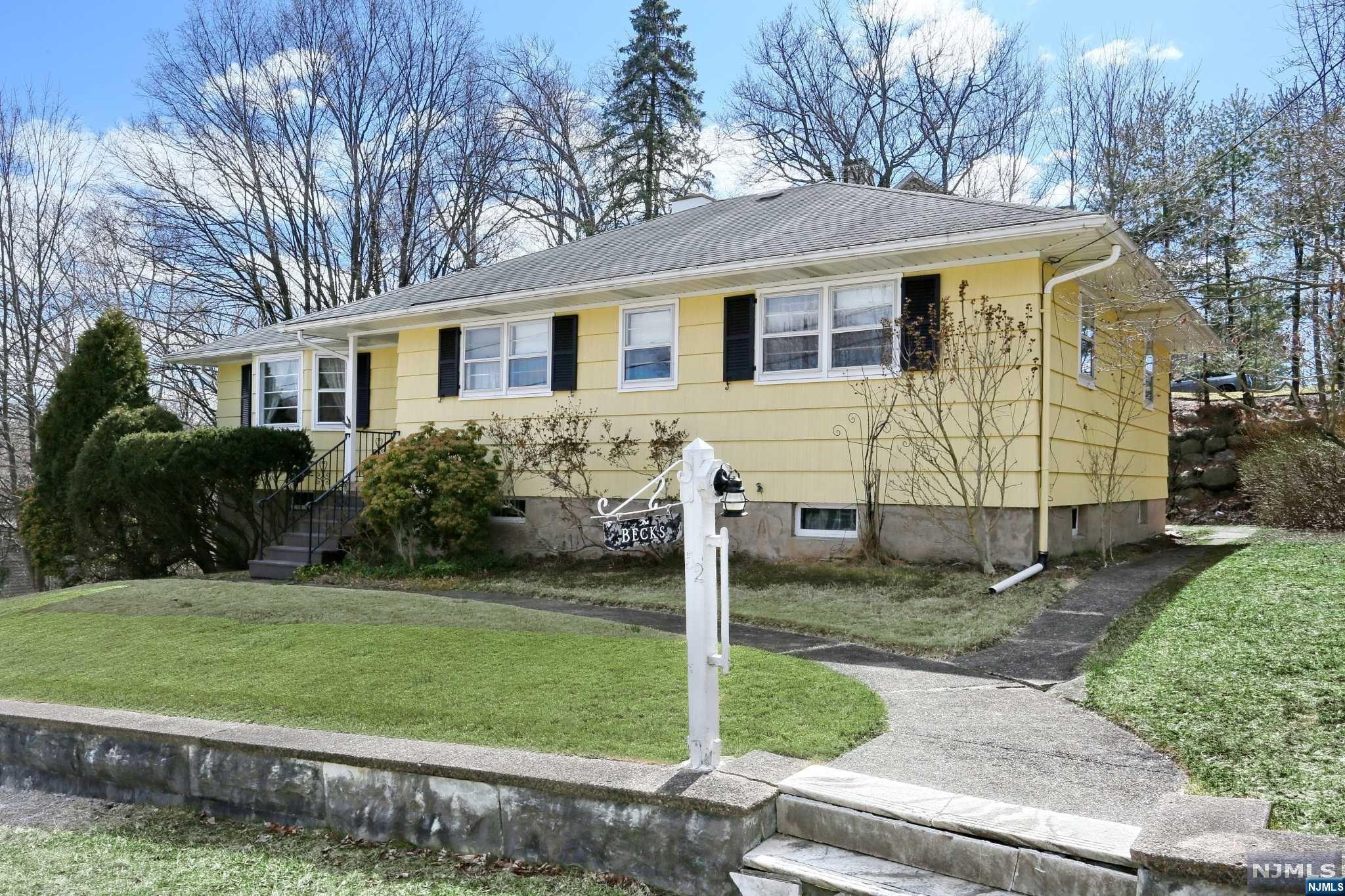 Welcome home to this well-built, 3 bedroom, 1 bath ranch style home in North Haledon. Conveniently located near shopping, William Paterson University and hiking at High Mountain Park. Enter the bright living room with beautiful hardwood floor, kitchen with breakfast area, 3 bedrooms with large closets and hardwood floors plus a den/office/bedroom. Enjoy the lovely sunroom looking over the backyard. The basement is partially finished with a laundry area, bonus bathroom, newer boiler and hot water heater. The attached oversized two car garage completes the lower level. Bring your TLC to make this home your own.