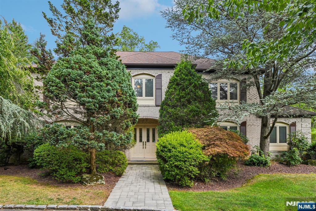 Nestled on a beautifully landscaped property in one of Livingston's most desirable neighborhoods, this custom-built 12-room home offers exceptional space, quality craftsmanship, and resort-style outdoor living. Built with steel beam construction and premium all-plywood 2x6 framing with enhanced insulation for added durability and efficiency, the home features 5 bedrooms and 4.1 baths with a versatile layout ideal for entertaining and everyday living. The main level offers a gracious living room, formal dining room, oversized family room with fireplace and custom built-ins and wet bar, spacious eat-in kitchen with center island and breakfast area, plus a desirable first-floor bedroom/in-law suite. A sunroom overlooking the backyard provides the perfect year-round retreat. The second level features generously sized bedrooms including a remarkable primary suite with spa-like bath featuring a soaking tub, oversized shower, dual vanities, Skylights and multiple walk-in closets. The finished walk-out basement offers expansive recreation space with direct access to the private backyard oasis complete with an in-ground oversized pool, hot tub, patio areas, and oversized deck surrounded by mature landscaping with in-ground sprinklers. Additional highlights include 3-zone HVAC, oversized garage, and abundant storage throughout. A rare opportunity to own a truly custom home with outstanding indoor and outdoor living spaces in sought-after Livingston. Showings will start on May 29th