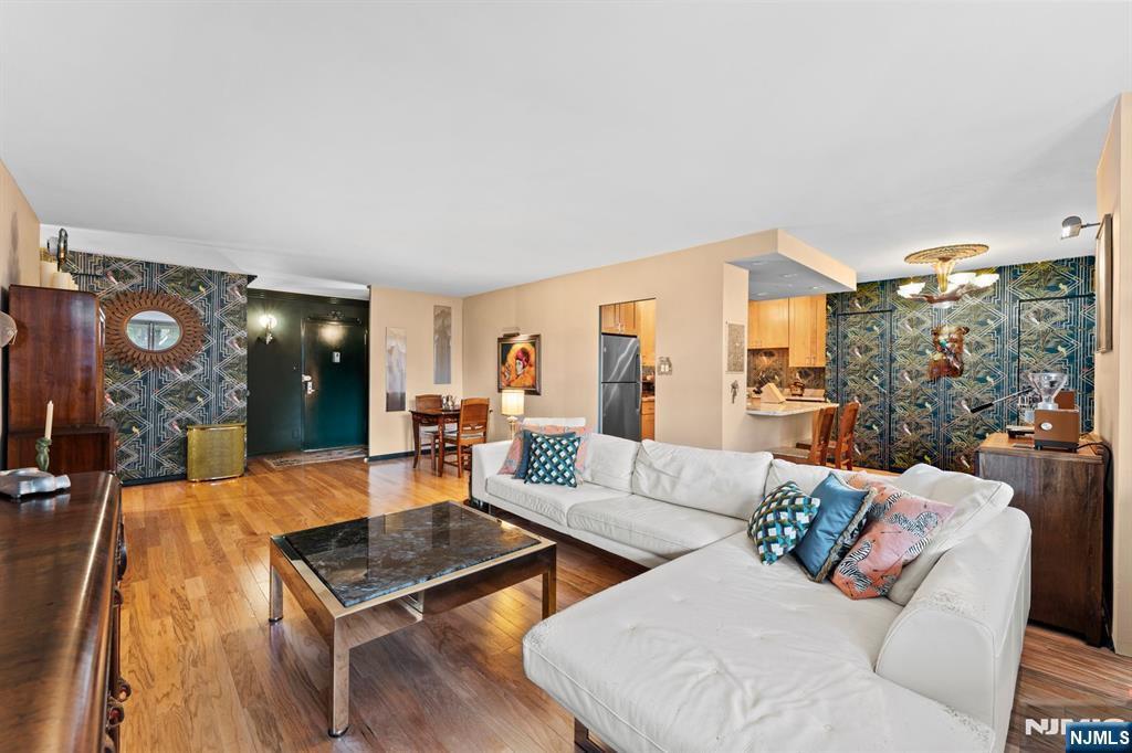 This fully renovated 1,100 sq ft Riviera Towers 1-bedroom residence blends modern upgrades with standout designer touches. Five closets include three fitted with custom adjustable organization systems. The bath features Brizo fixtures, a genuine silver-leaf ceiling, marble flooring, and walls finished in iridescent spa-grade glass tile. The kitchen showcases maple KraftMaid cabinetry, marble countertops, and GE stainless-steel appliances. Throughout the home youâ€™ll find custom woodworking, unique wallpaper imported from the UK, and bubble glass hardware. The only shared wall in the unit was professionally soundproofed and HVAC unit have been recently serviced for added peace of mind. Riviera Towers offers resort-style amenities: a pool deck with panoramic NYC skyline and Hudson River views, barbecue area, library, 24-hour concierge and doorperson, optional on-site gym membership, storage, parking, and a convenience store. Commuting is a breeze with buses to NYC, nearby Light Rail, and the NY Waterway ferry. Local parks, a Friday farmers market, cafes, and restaurants add to the vibrant Boulevard East lifestyle. Antique light fixtures, curtains, and the bedroom vanity are excluded from the sale,