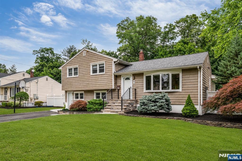 Lovely home situated on a quiet, tree-lined street on the desirable West Side of Paramus, with a charming park just at the end of the block. Beautifully updated & completely move-in ready, this split-level home offers 3 bedrooms, 2 full bathrooms & exceptional living spaces throughout. Welcoming entry foyer features a custom barn door storage system. The main level boasts an open-concept LR, DR & stunning kitchen featuring a huge center island, quartz countertops, SS appliances & sleek European-style cabinetry. A bright sunroom overlooks the backyard. The upper level offers 3 bedrooms & beautifully renovated full bath w. a steam shower, tub, designer tile & modern vanity. The ground-level garage has been converted into a spacious family room with a 2nd full bathroom, creating ideal flex space for a rec room, office, gym, or playroom. Unfinished basement, whole-house water filtration system, newer HVAC & meticulously maintained. Large, level backyard offers plenty of outdoor space & storage shed. The previous above-ground pool was removed & existing pool equip may potentially be reused. Excellent curb appeal with lovely landscaping, modern railing & a driveway accommodating up to 4 cars. Located in one of Bergen County's most desirable communities, Paramus is known for its great schools, exceptional shopping, convenient access to major highways & wonderful community. Walking distance to transportation into NYC & close proximity to Ridgewood's vibrant dining & shopping!