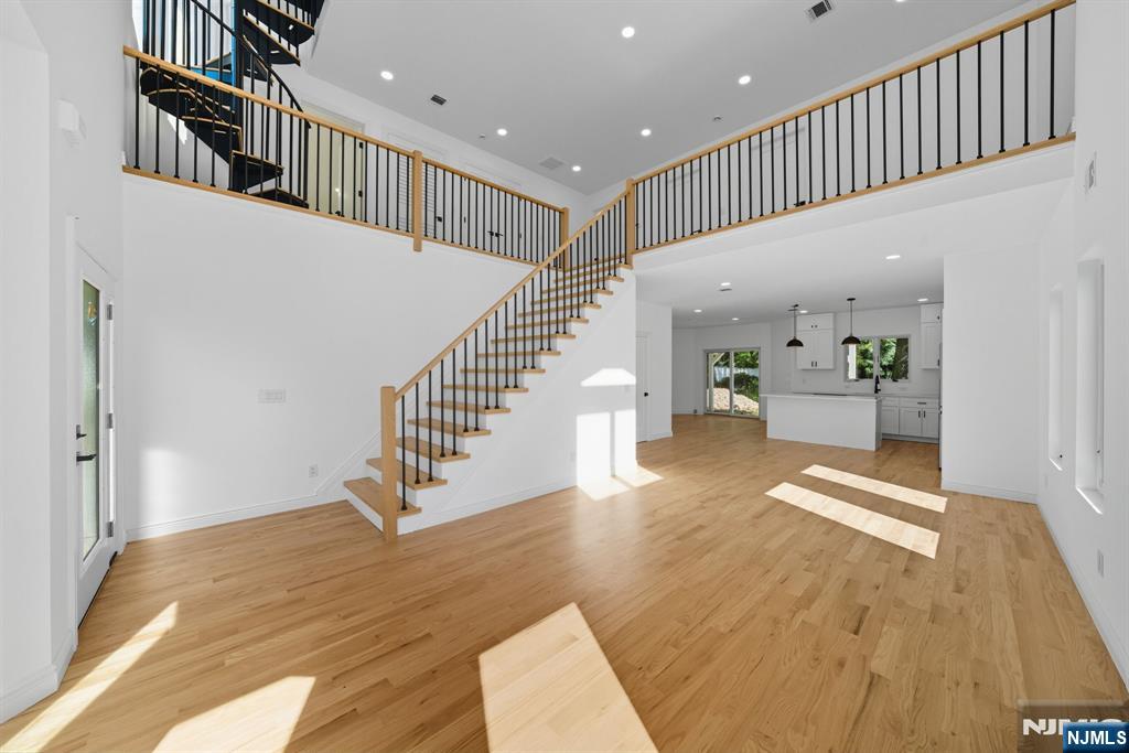 Custom-Built, Contemporary, and Completed New Construction Home awaits you.. Bright and Sun-Filled Open-Concept Layout features Luxury Living with Everyday Functionality. Be greeted by a 2-story Great Room (LR/DA combo), filled with Natural Light, flowing effortlessly into a Modern Eat-In Kitchen for the Culinary Enthusiasts, Breakfast Nook, and Powder Room. First floor also includes a Bedroom with Full Bath, ideal for guests or extended families. Second floor highlights a Spacious Landing perfect for a Work/Study area and Laundry Closet w/ Hook-ups. Prim. Bedroom w/ Prim. Bath with Spa-Like Soaking Tub, Walk-In Shower and access to Shared Terrace with Adjacent Bedroom. Bedroom with Ensuite and Hallway Full Bath completes the Second Floor. Bonus Loft Area is perfect for a Media Room, Home Office, Play Room, and so much more. Additional highlights include 2-car garage and hardwood floors throughout. Location is convenient to NYC transportation, train, shopping, restaurants, parks, house of worship, etc. etc. Great town for commuters offering Great Schools. Home is Complete and Ready for you to Move on In!