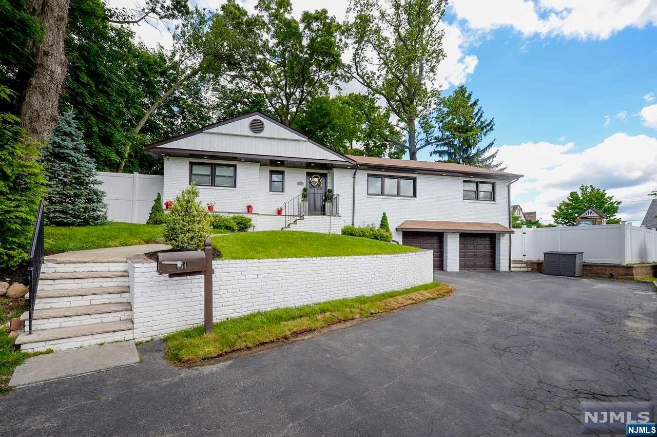 Meticulously maintained raised ranch situated at the end of a cul-de-sac. Purchased in 2021 and fully renovated from top to bottom. No expense spared! Gleaming hardwood floors throughout the first floor. Light filled open concept living room, dining room and chef's kitchen. Beautiful modern den off of the kitchen. Primary bedroom has two double closets with custom built ins and third with sliding barn door. Second and third bedrooms also have double closets. Beautifully updated full bath with double sinks and glass enclosed shower. Custom laundry room and powder room complete the first floor. Downstairs is an entertainer's paradise! Fully finished basement with multiple spaces, custom wet bar with both wine and beverage fridge. Separate office, 4th bedroom and full bath complete the space! Backyard is fully fenced and beautifully landscaped with trex deck and a separate patio with Pergola. Nothing to do but unpack!