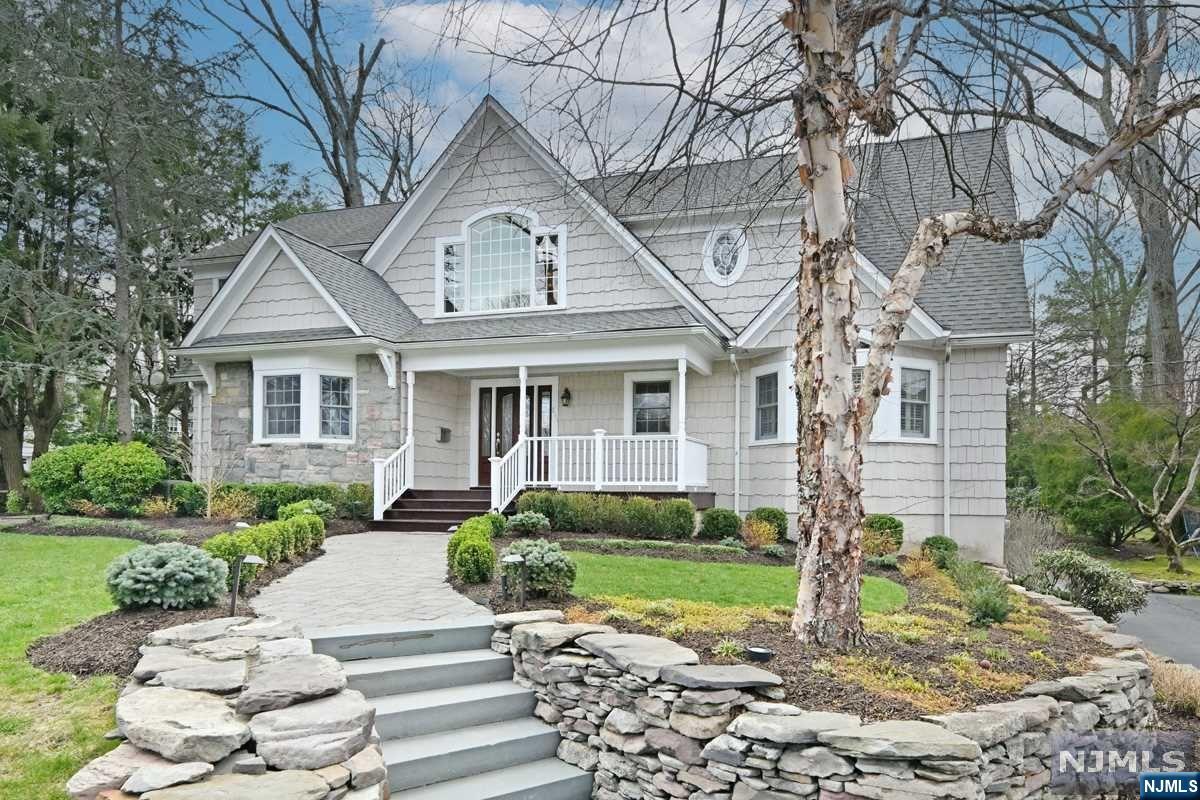 Masterfully designed & renovated and in a top Willard School area location, this 3,827 square foot, 5 bedroom, 4 1/2 bath residence has the sought-after open floor plan concept that will wow you. Welcomed by an open porch with mahogany flooring, it opens to a 2-story entrance foyer. The living room has built-ins & fireplace. Formal DR. The great room & gourmet kitchen overlook the paver patio, outdoor cooking station, manicured lawn & gardens. Stunning 1st fl primary BR suite features an outstanding bathroom with both tub & shower & a spacious dressing room/WIC plus exceptional home office. 2nd fl with 3 bedrooms, 2 baths, 2nd laundry room & 2 upper foyer sitting areas. Finished lower level opens to grade offering a large office/BR with private outside entrance, full bath, mud room, playroom with fireplace, Ldy & access to the attached 4-car garage wired for EV charger. WHOLE HOUSE GENERATOR. Don't miss seeing this gorgeous residence.